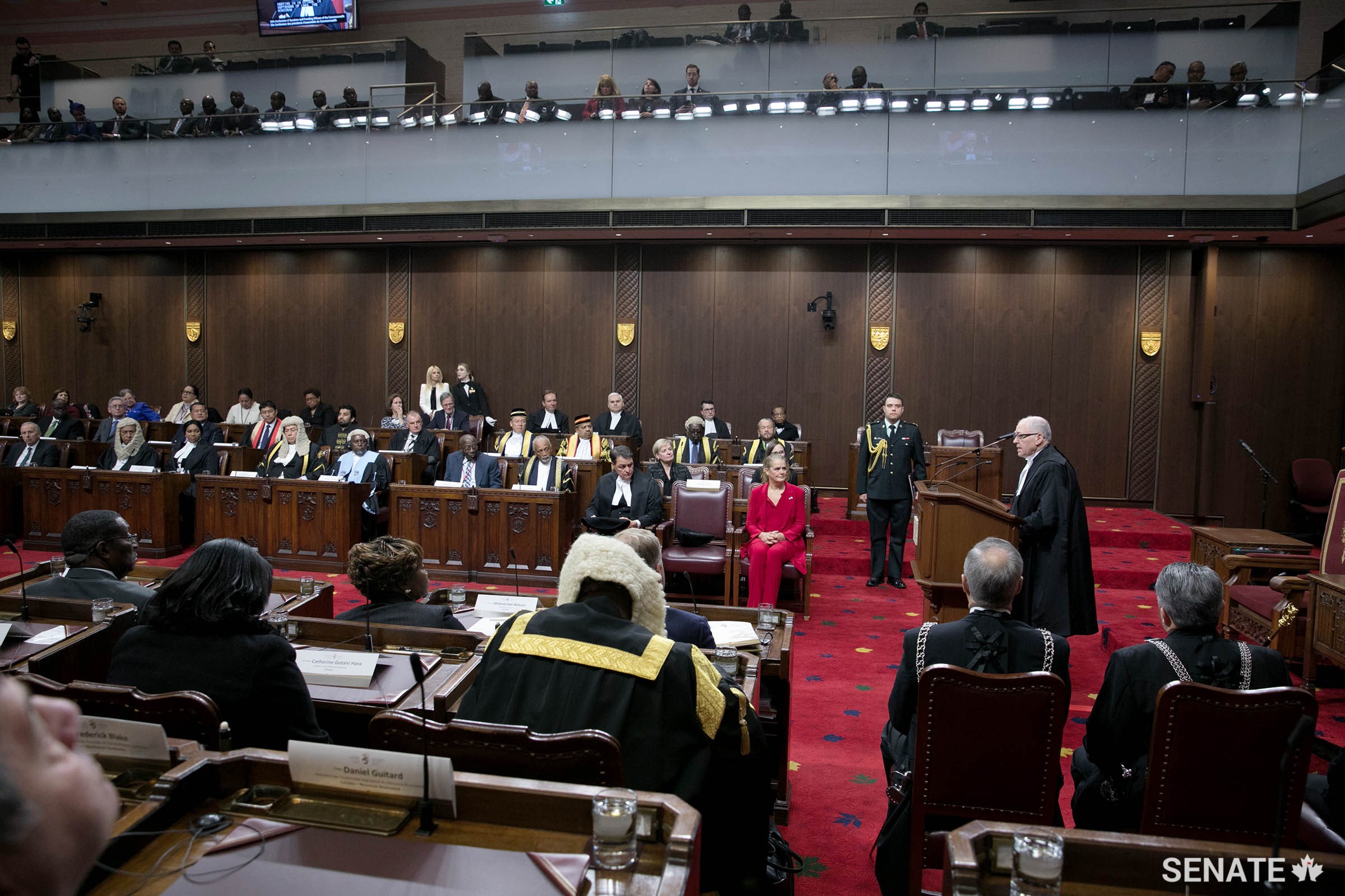 Governor General Julie Payette, centre, listens closely as Speaker Furey continues his opening remarks in the Senate Chamber.