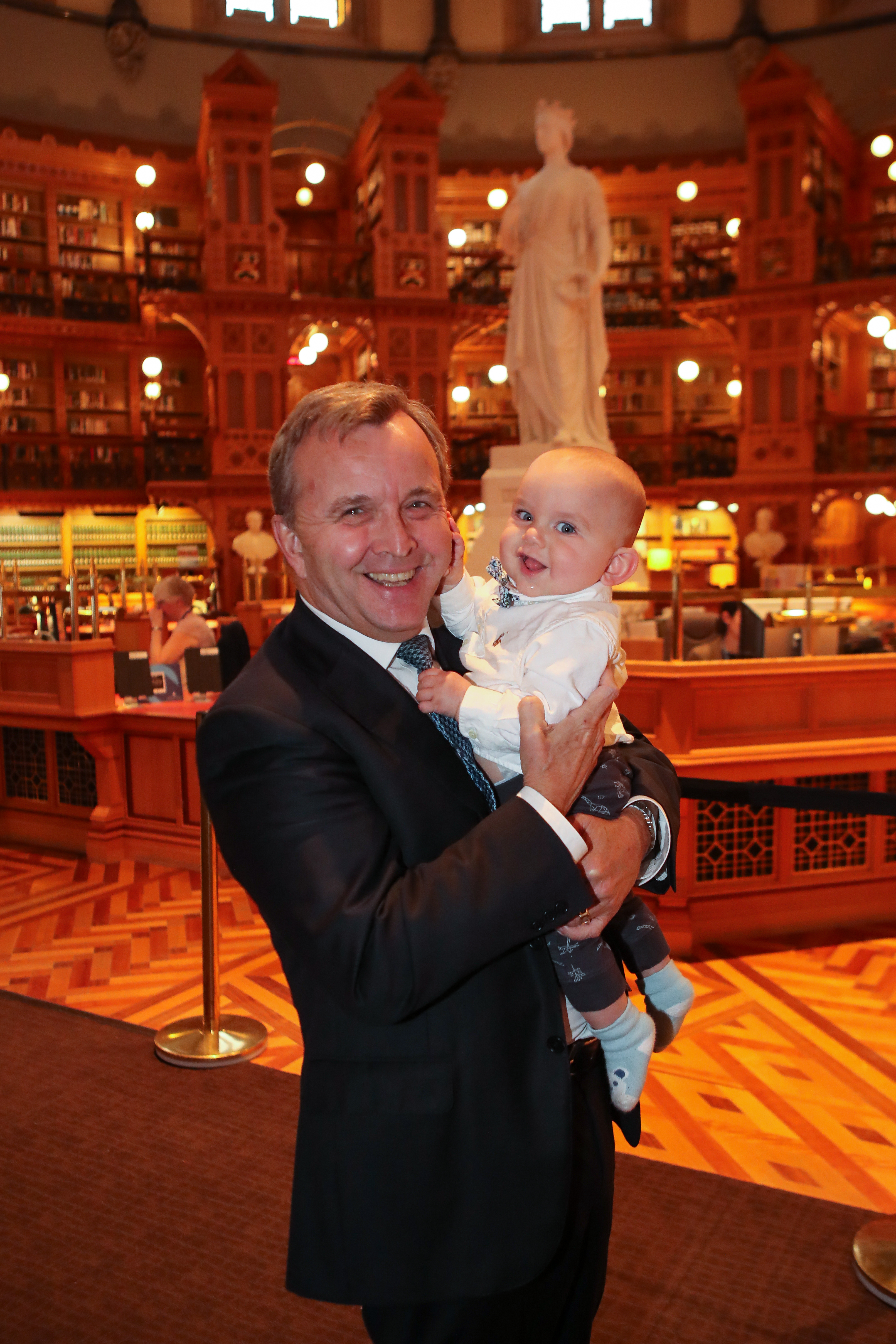 Senator Mitchell visits the Library of Parliament in Centre Block with his grandson. (Photo credit: Greg Kolz)