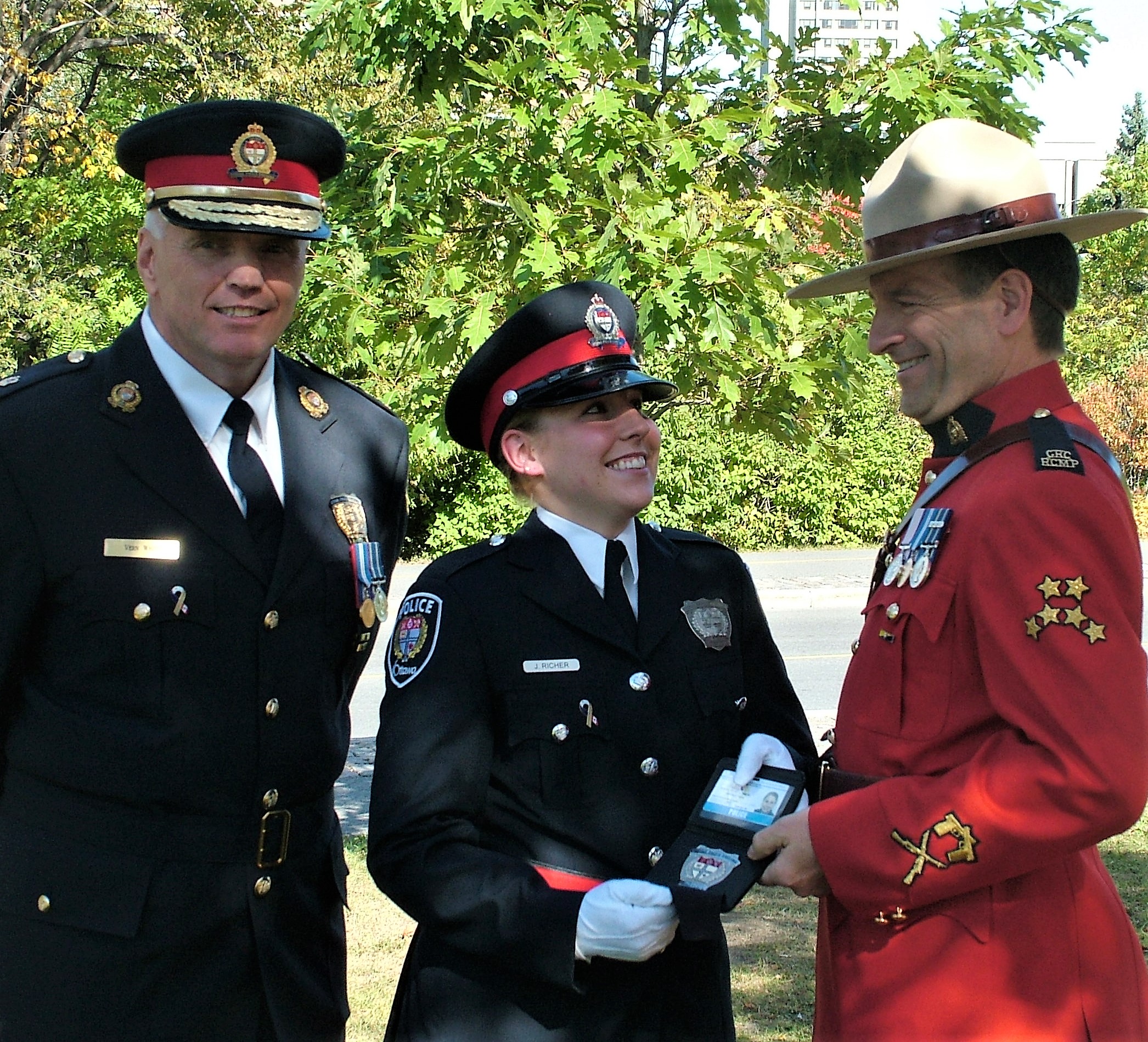 Senator White smiles with RCMP Staff Sgt. Marc Richer, whose daughter, Const. Julie Richer, was sworn into the Ottawa Police Service on September 9, 2009. Senator White was chief of the Ottawa Police Service from 2007 to 2012.