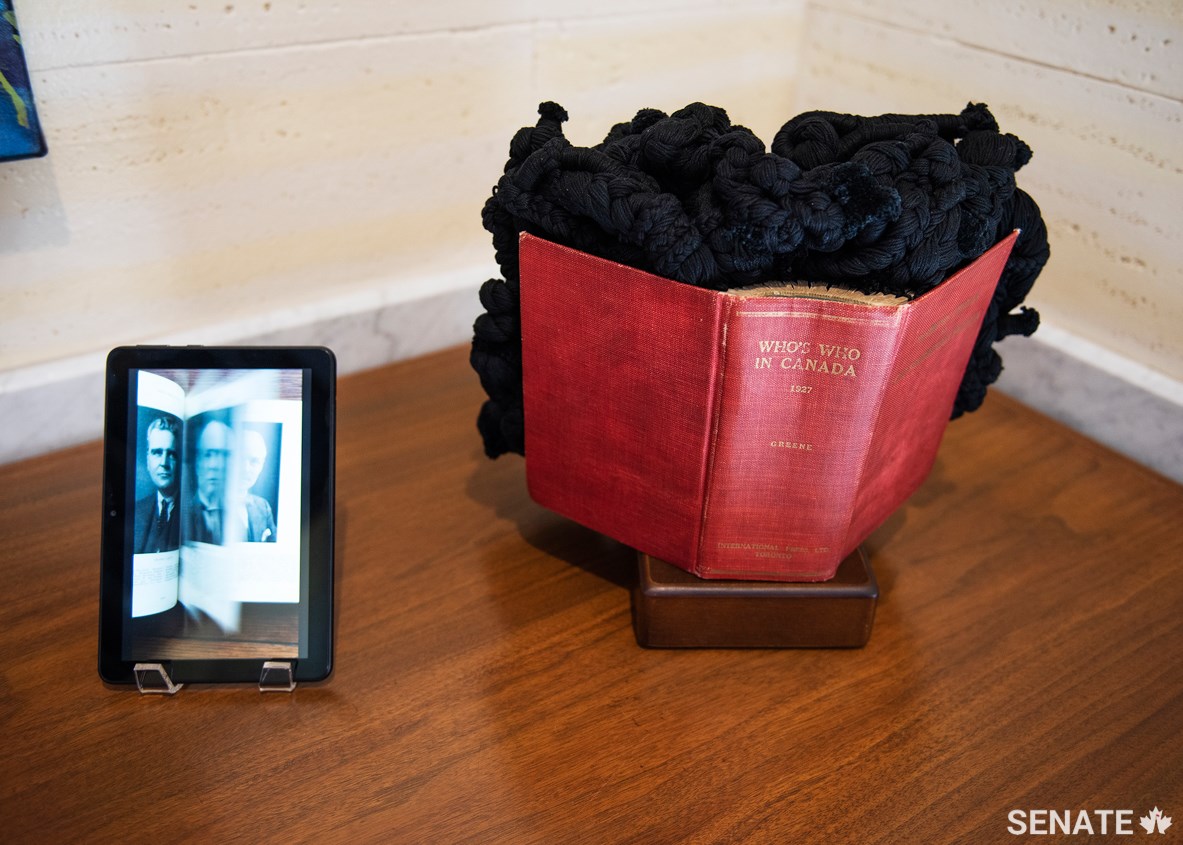 Vancouver-based artist Chantal Gibson’s altered text Who’s Who in Canada 1927 was installed in the Senate of Canada Building on Friday, September 18, 2020. An e-reader displaying a recording of the book’s original pages is part of the installation.