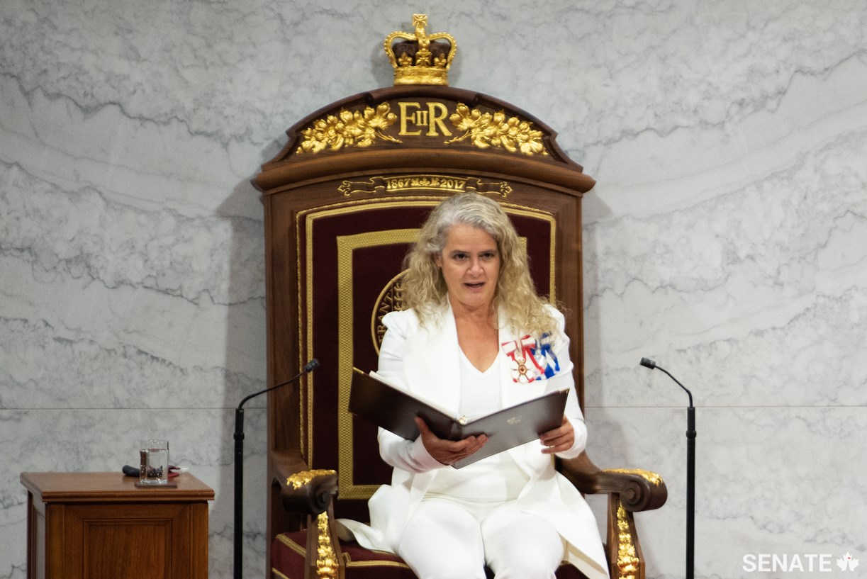 Seated in the walnut-wood throne, Governor General Payette reads the Speech from the Throne to launch the second session of the 43rd Parliament.