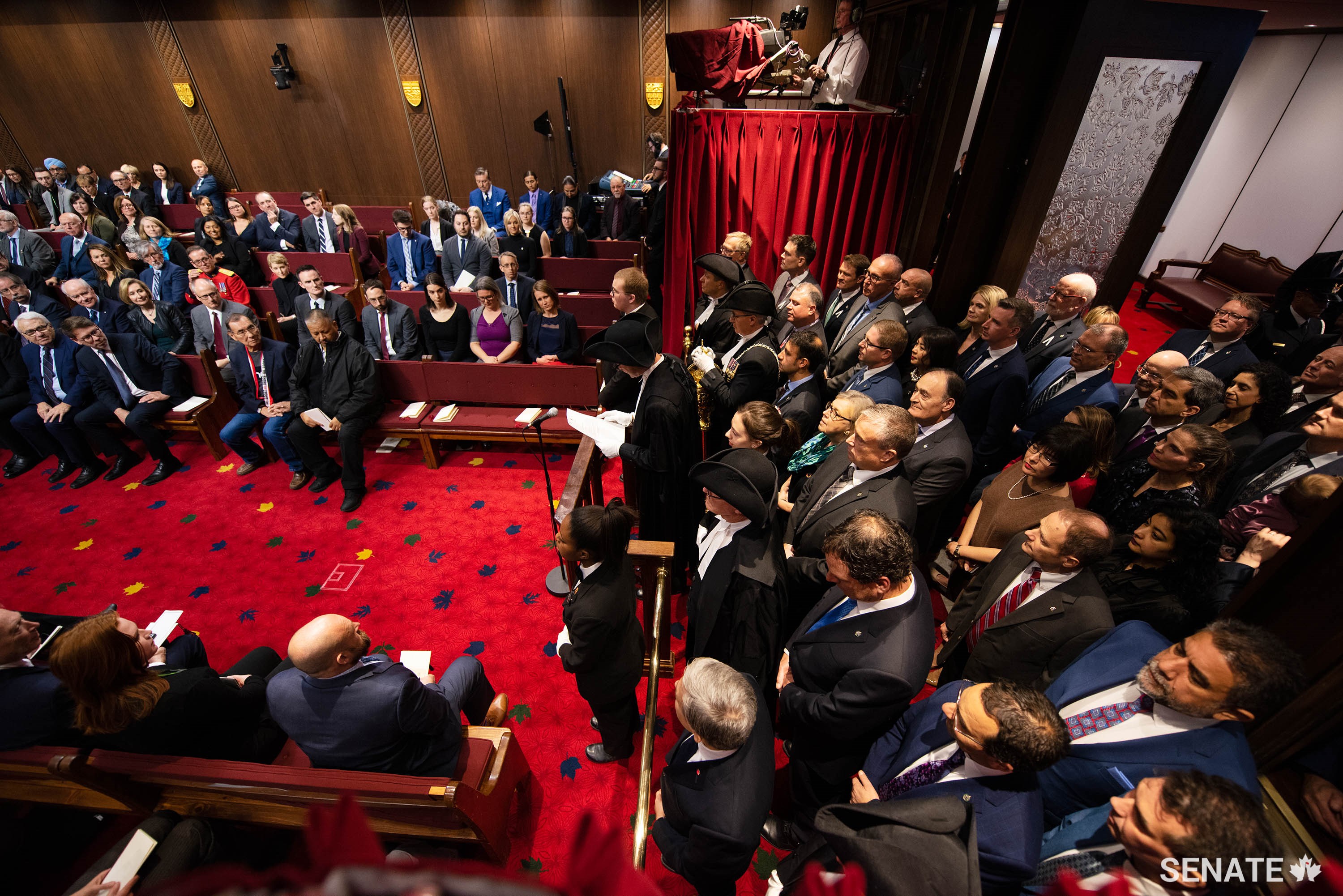 In a stark contrast from 2020, dozens of MPs filled the Senate entrance during the Speech from the Throne on December 5, 2019, as senators and several other invited guests inside the crowded Chamber looked on.