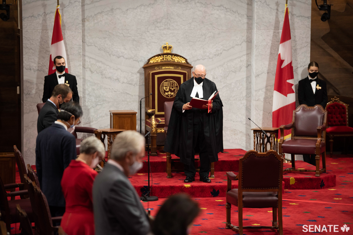 Speaker of the Senate George J. Furey, Q.C. reads a prayer inside the Senate Chamber at the start of the official ceremony.