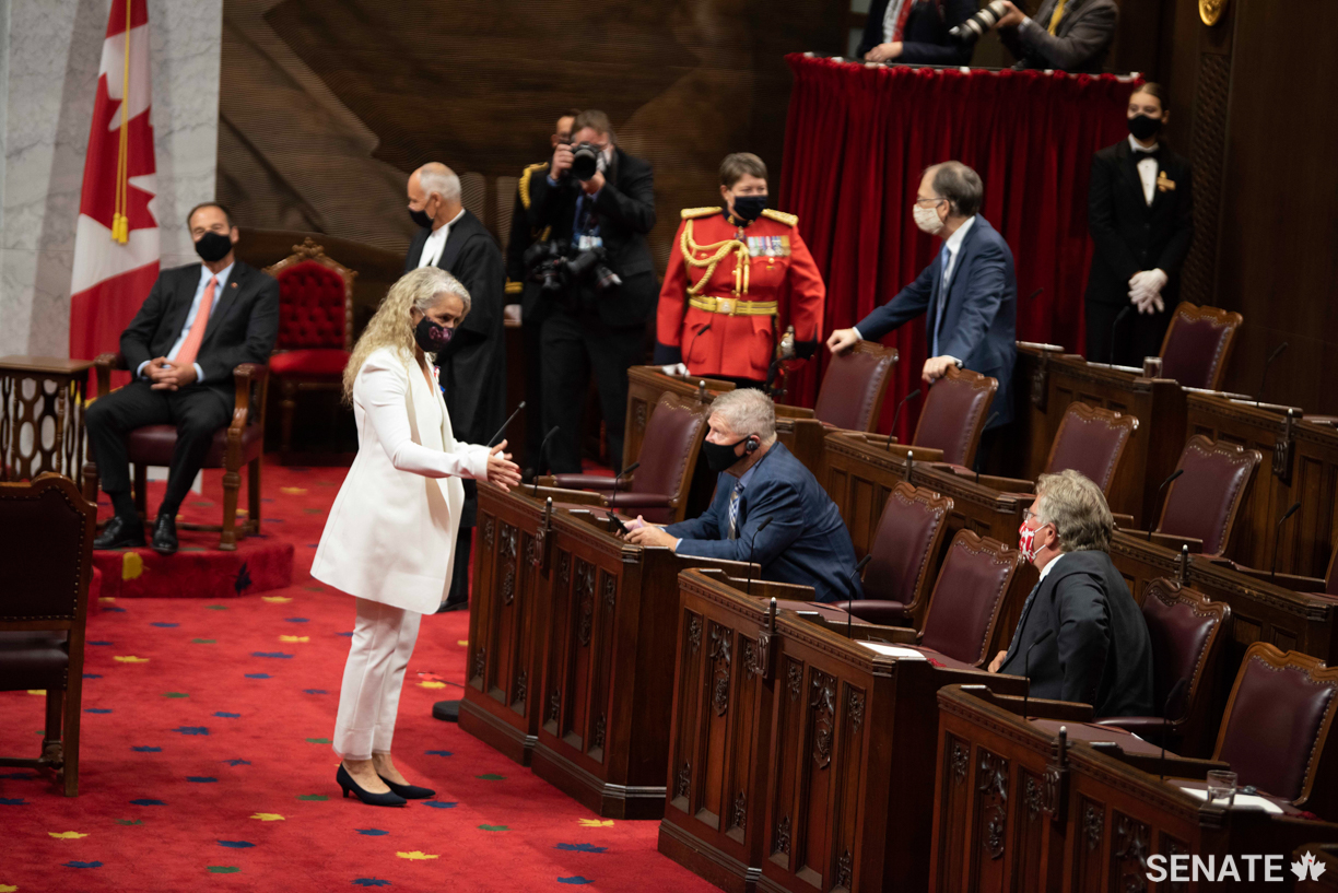 Governor General Payette speaks with senators ahead of the ceremony.