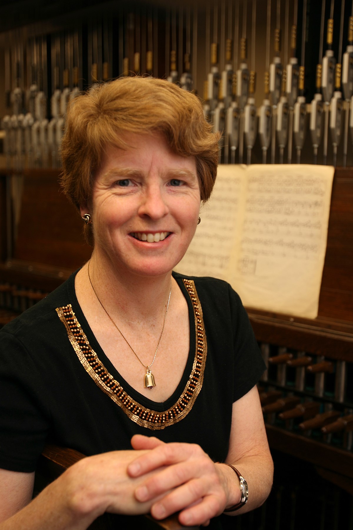 Dominion Carillonneur Andrea McCrady prepares to play the Peace Tower carillon on Parliament Hill in Ottawa on December 13, 2013. Dr. McCrady has been the Dominion Carillonneur since 2008. The wooden keyboard console is the original from 1927. (Photo credit: House of Commons)