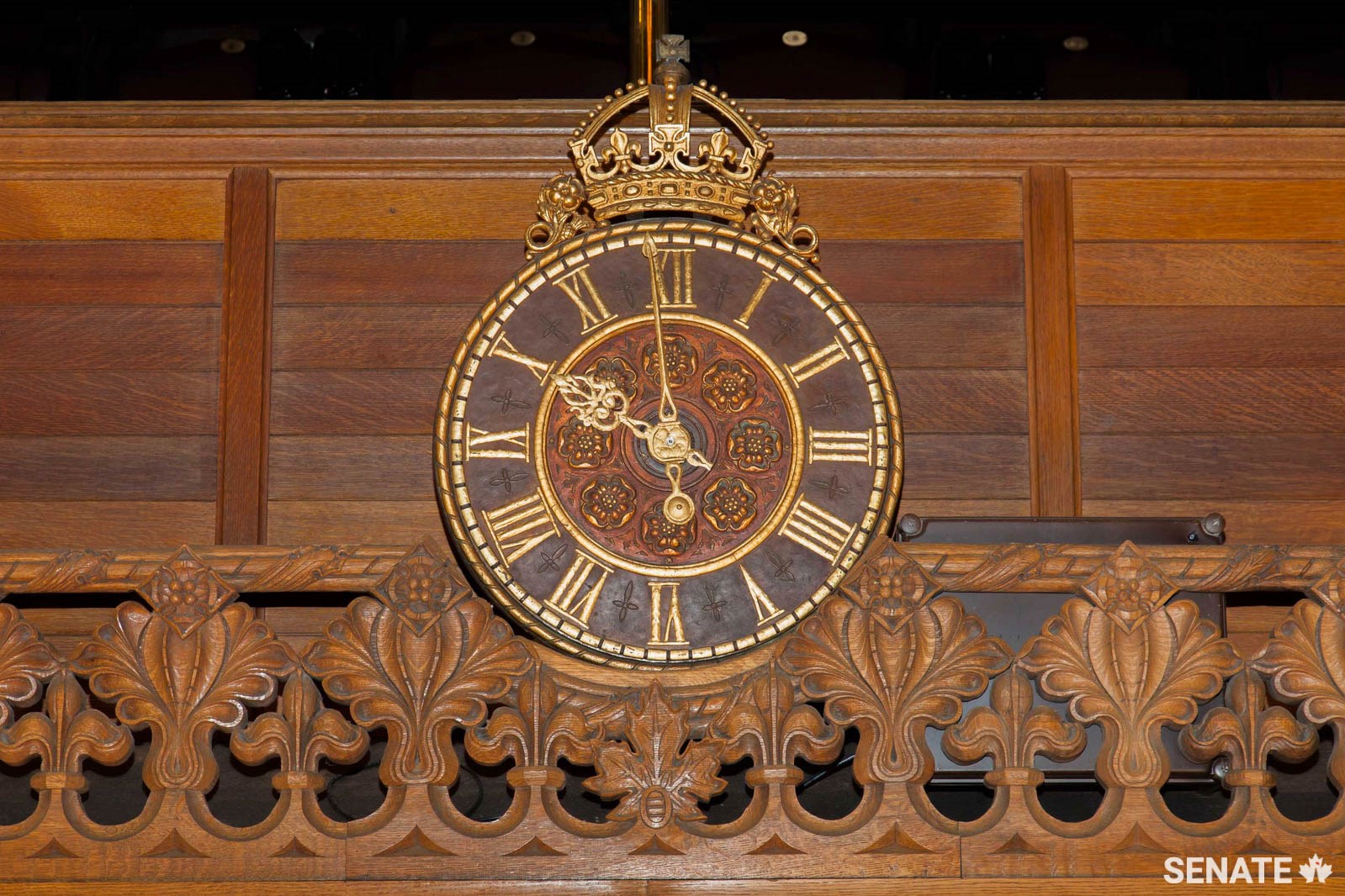 The clock above the Senate Chamber entrance features a partly shrouded Ottawa Senators hockey team logo. One of the sculptors working under Elzéar Soucy added it in the 1920s.