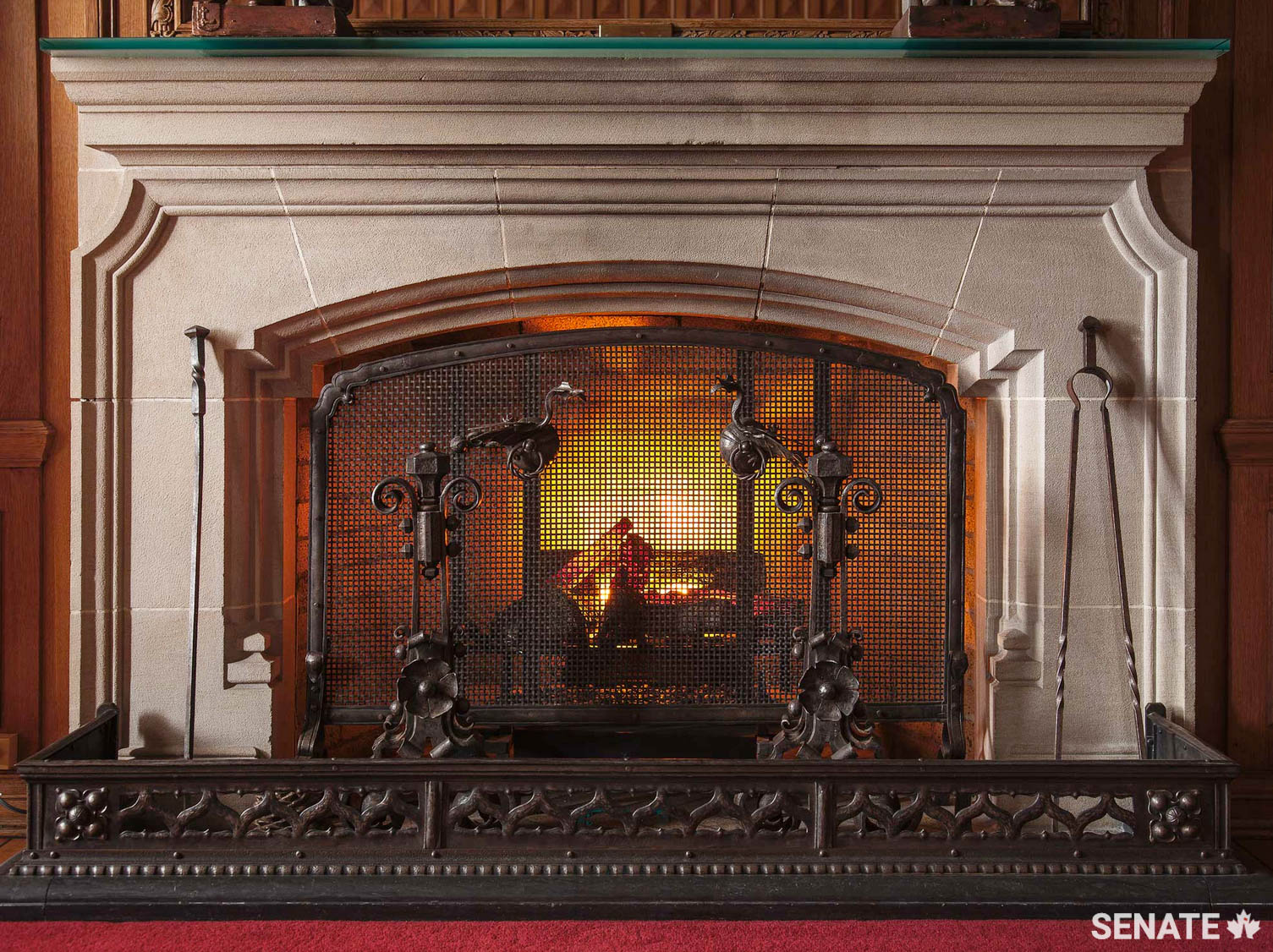 The elaborate fireplace utensils ironworker Paul Beau created for the Senate Speaker’s offices contain Gothic-inspired curves and stylized foliage typical of his work.