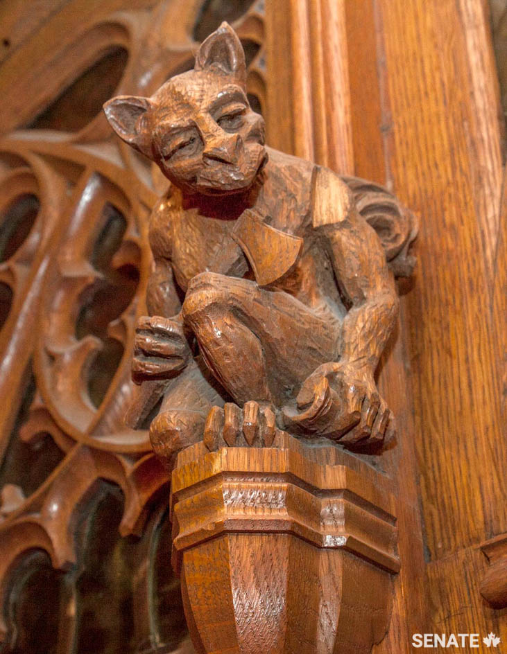 Elzéar Soucy’s team was responsible for the whimsical <a href='https://sencanada.ca/en/sencaplus/how-why/gargoyles-and-grotesques-parliament-hills-sinister-sentinels/' target='_blank'>grotesques</a> — not gargoyles! — that flank the entrance to the Chamber.
