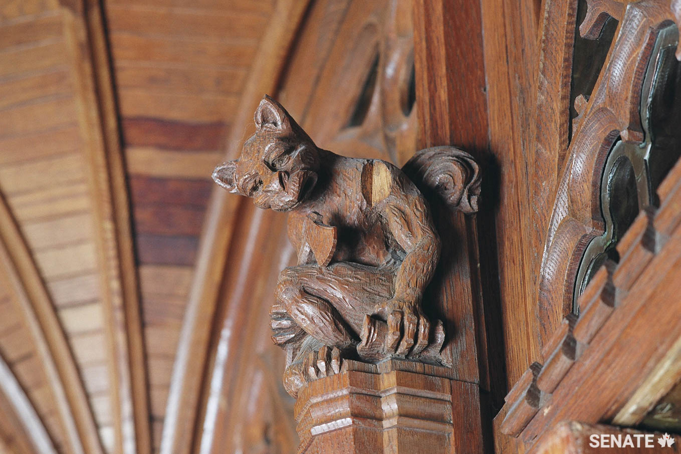 On the opposite side of the doorway, a grotesque wielding a hatchet monitors who comes and goes.