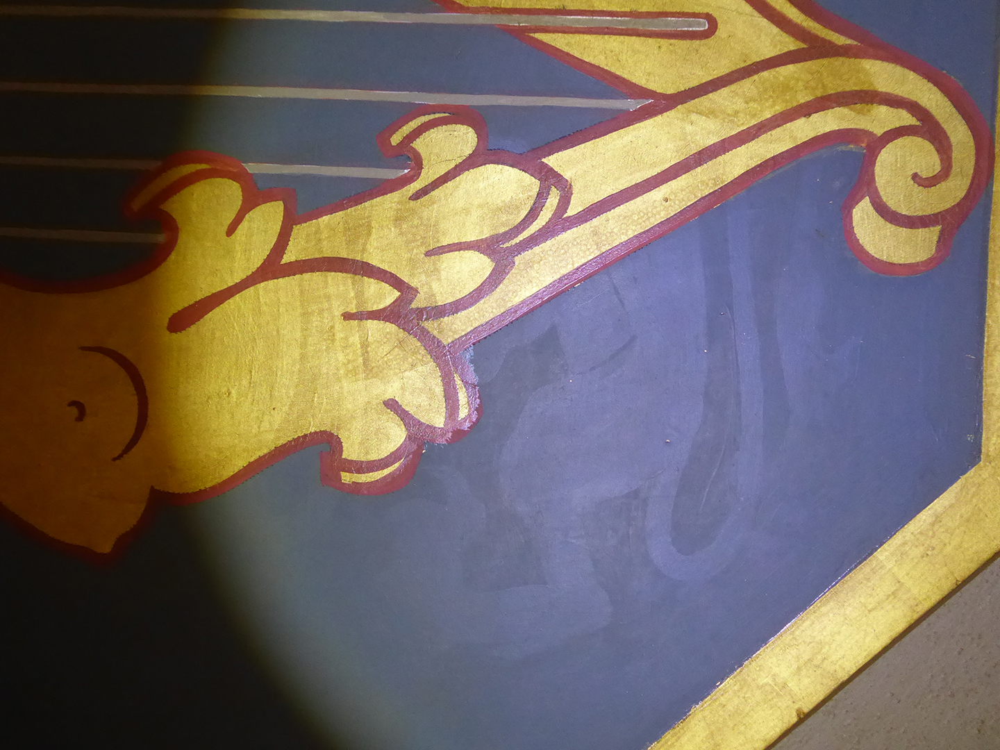 A ghost image on a ceiling panel reveals parts of the ceiling were painted over. Experts theorize the original image may have been a sample for approval. (Photo credit: Public Services and Procurement Canada)