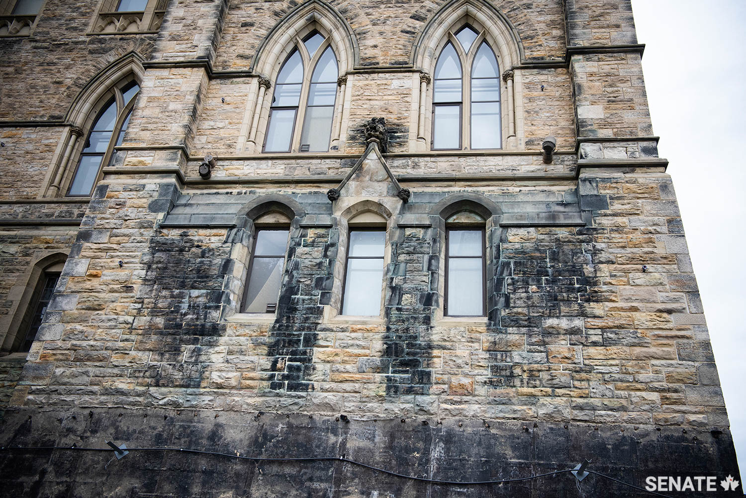 A century of attack by atmospheric pollution and microorganisms has discoloured large sections of Centre Block’s stone exterior.