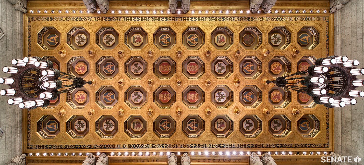 The 12 lanterns on each chandelier were upgraded in 1959 to cylindrical shades so the fixtures would project more light. The chandeliers, which also hold a single globe at their centre, are normally suspended about 5.5 metres from the ceiling on eight hanging rods.