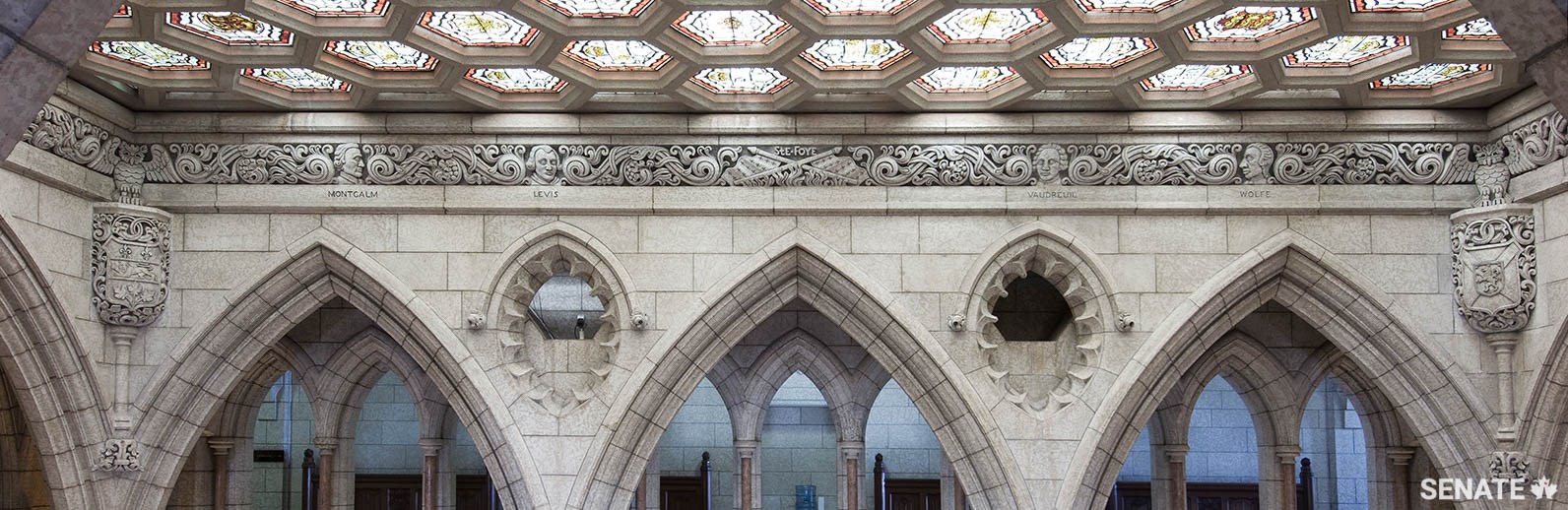 From 1957 to 1959, William Oosterhoff and his team carved this frieze high in the Senate foyer. It tells the story of Canada up to Confederation through its earliest historical figures.