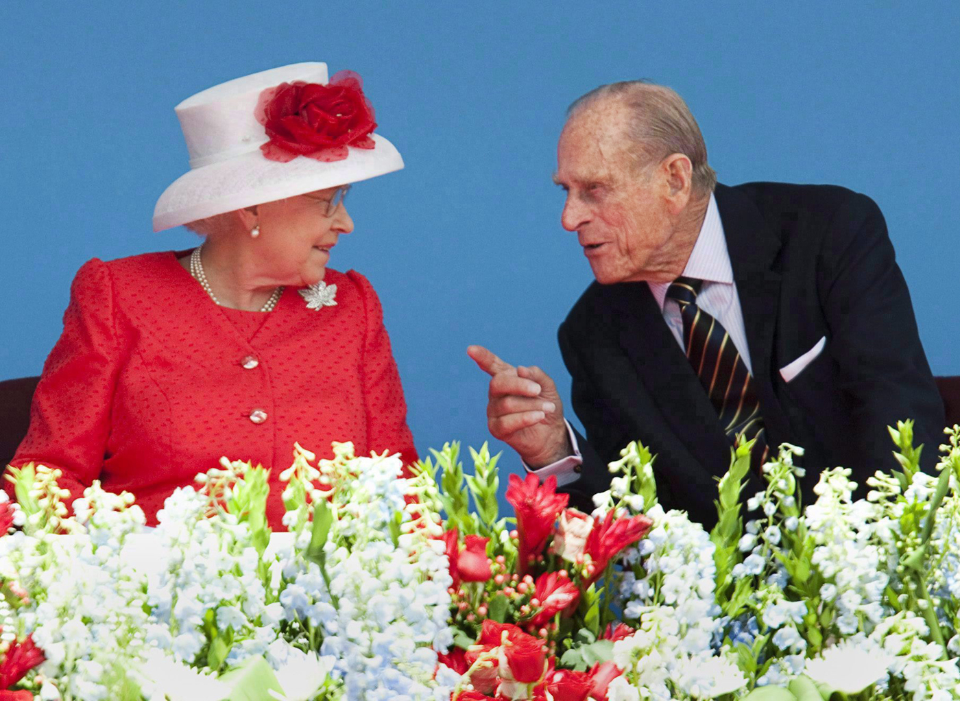 Queen Elizabeth and Prince Philip chat during Canada Day celebrations on Parliament Hill in 2010. (Photo credit: The Canadian Press)
