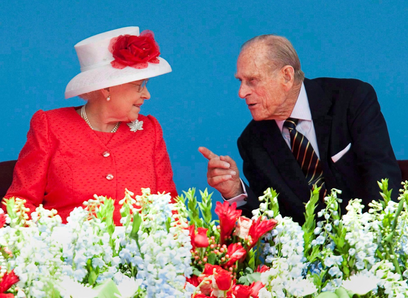 Queen Elizabeth and Prince Philip chat during Canada Day celebrations on Parliament Hill in 2010. (Photo credit: The Canadian Press)