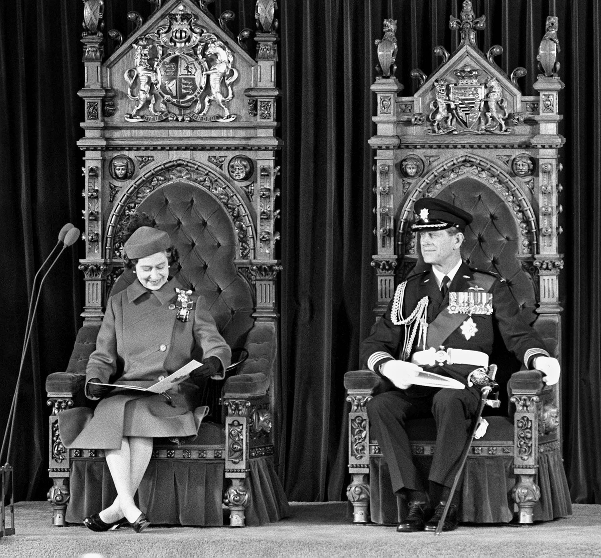 Queen Elizabeth and Prince Philip take their seats on the royal thrones on Parliament Hill for the signing of the Proclamation of the Constitution Act in 1982. The thrones normally occupy a dais at the head of the Senate Chamber in Centre Block but were moved to a stage in front of the building for the ceremony. (Photo credit: The Canadian Press)