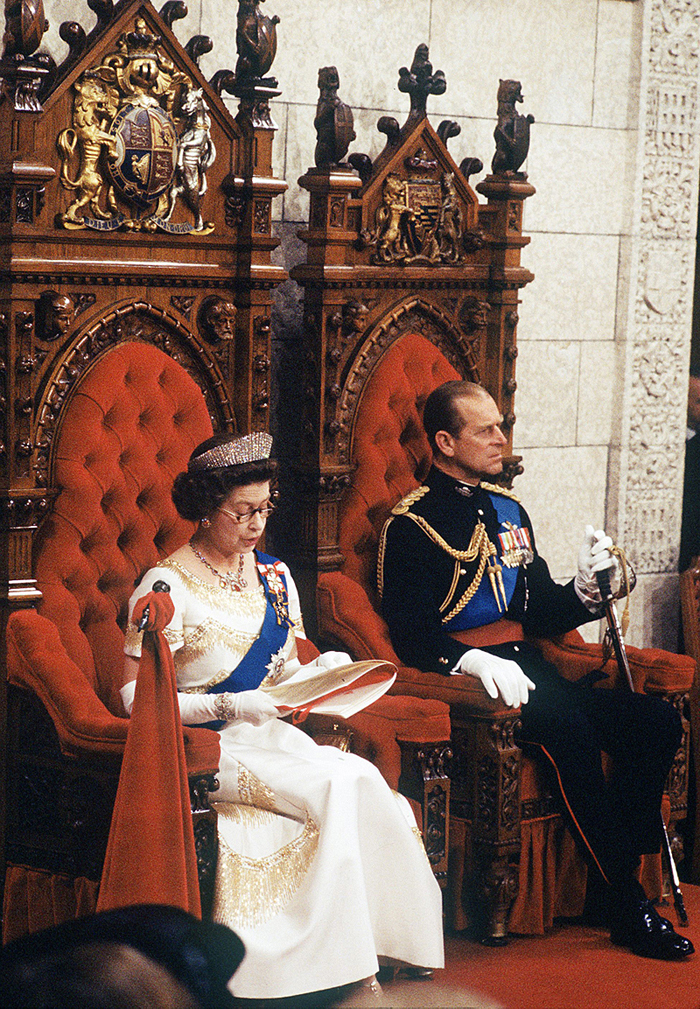 Queen Elizabeth reads the throne speech from the monarch’s throne in the Senate Chamber, with Prince Philip at her side in the consort’s throne, in 1977. (Photo credit: The Canadian Press)
