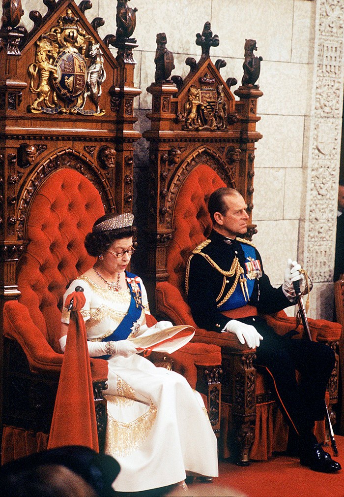 Queen Elizabeth reads the throne speech from the monarch’s throne in the Senate Chamber, with Prince Philip at her side in the consort’s throne, in 1977. (Photo credit: The Canadian Press)