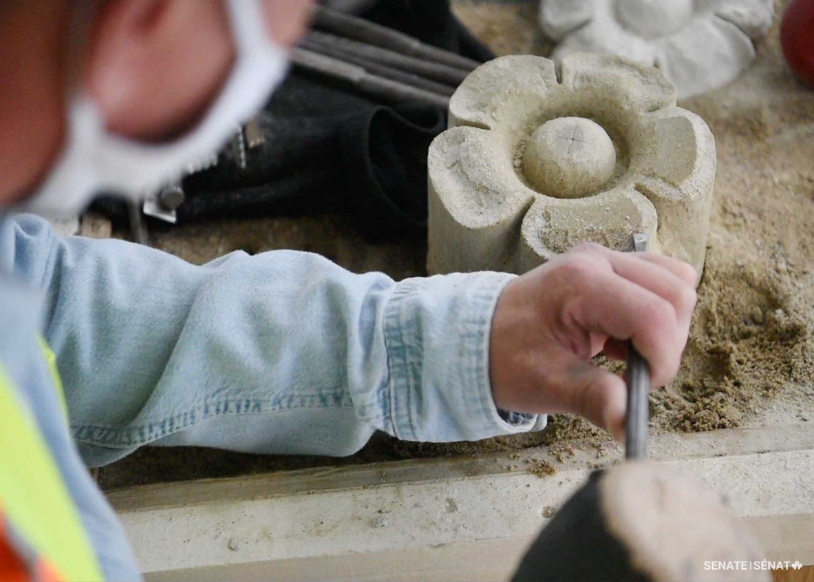 A handful of the stone flowers had to be fully replaced. Luckily, extracting them from the masonry isn’t too complicated; the joints must first get cleaned out and then masons can grab the flower and pull it out. Once carved, the new flower is popped in and secured with new mortar.
