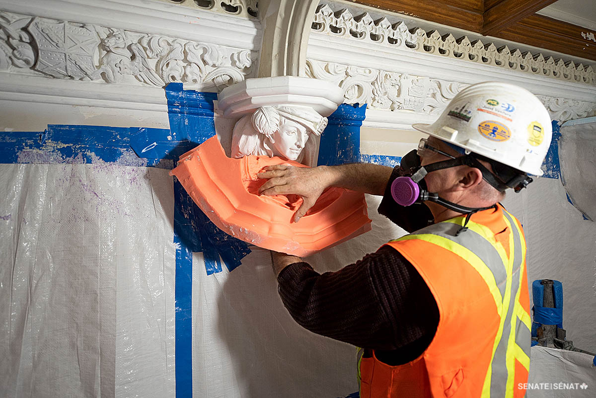 Step 7: Wearing a respirator to protect himself from airborne plaster dust and lead remnants in the old paint, a conservator removes the silicone mould from the plaster figure, almost like how one might remove a peel-off facial treatment.