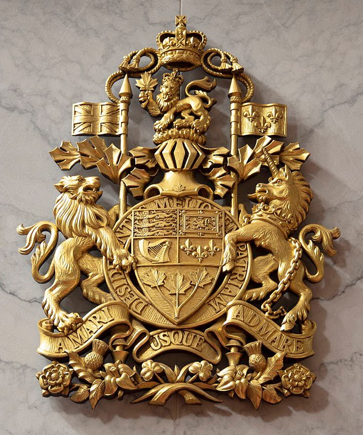 The Arms of Canada that Mr. White carved in 2017 hang above the Speaker’s dais in the temporary Senate Chamber. (Photo credit: Public Services and Procurement Canada)