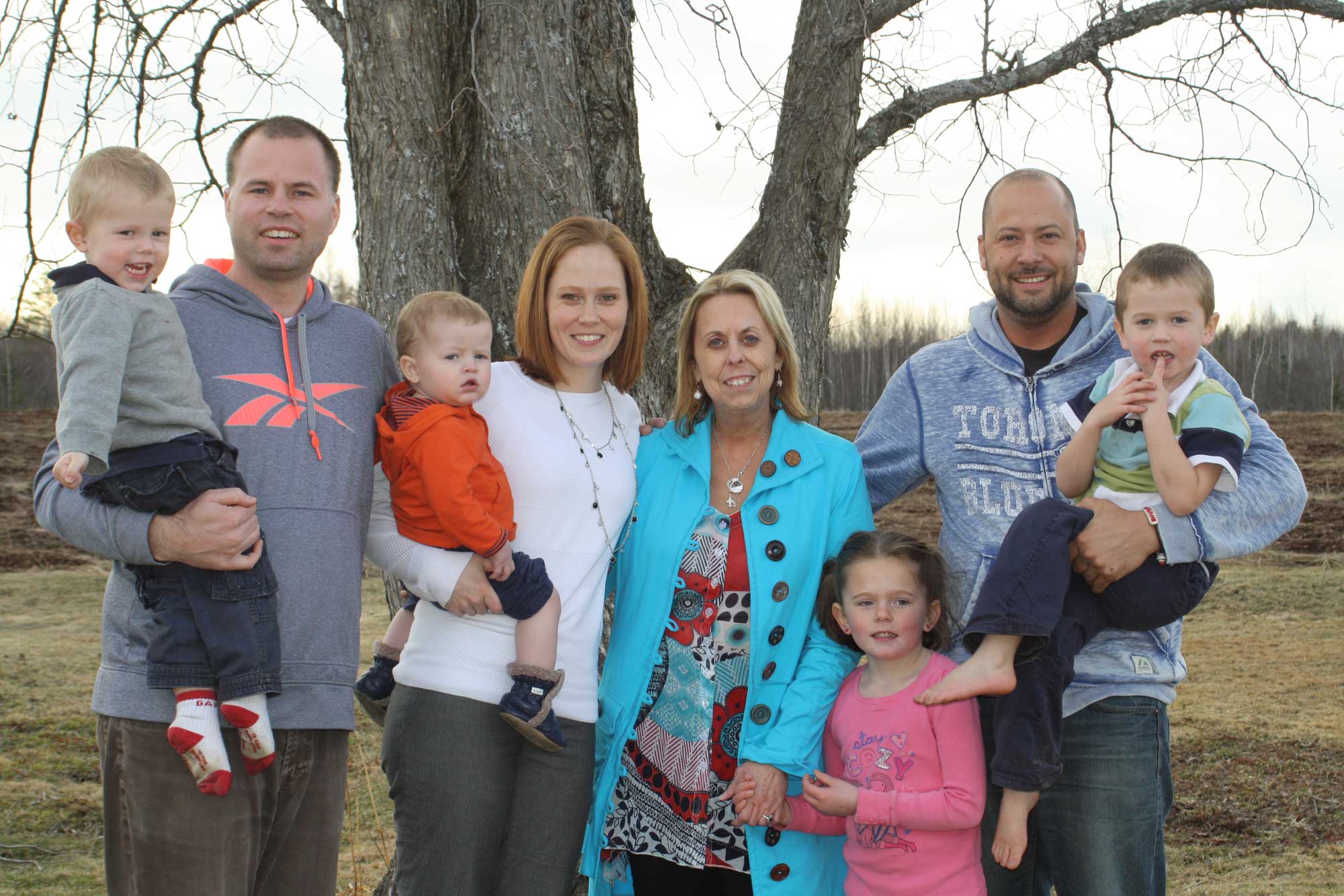 Senator Keating embraces her family during an Easter celebration. From left to right: grandson Oliver, son-in-law Davie, grandson Wallace, daughter Stephanie, Senator Keating, granddaughter Grace, son Mathieu and grandson Harrison. (Photo credit: Office of the late Senator Keating)