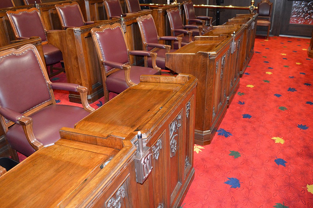 Before restoration work, the Senate Chamber’s 100-year-old desks showed noticeable signs of daily wear and tear. (Photo credit: Ottawa Furniture Repair)
