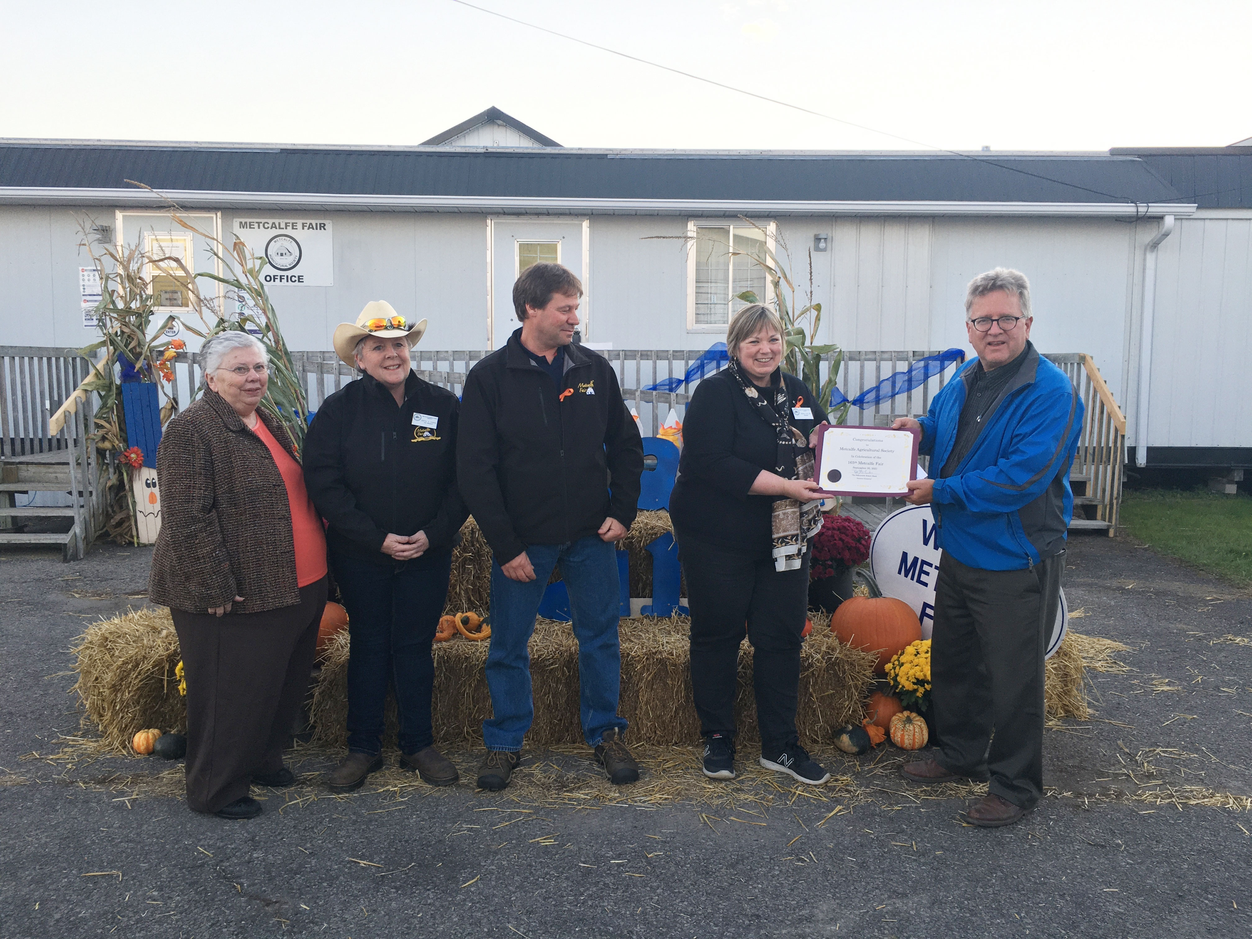 Thursday, September 30, 2021 – Senator Robert Black presents the Metcalfe Fair’s board of directors with a certificate to mark their 165th anniversary in the rural south end of Ottawa, Ontario.
