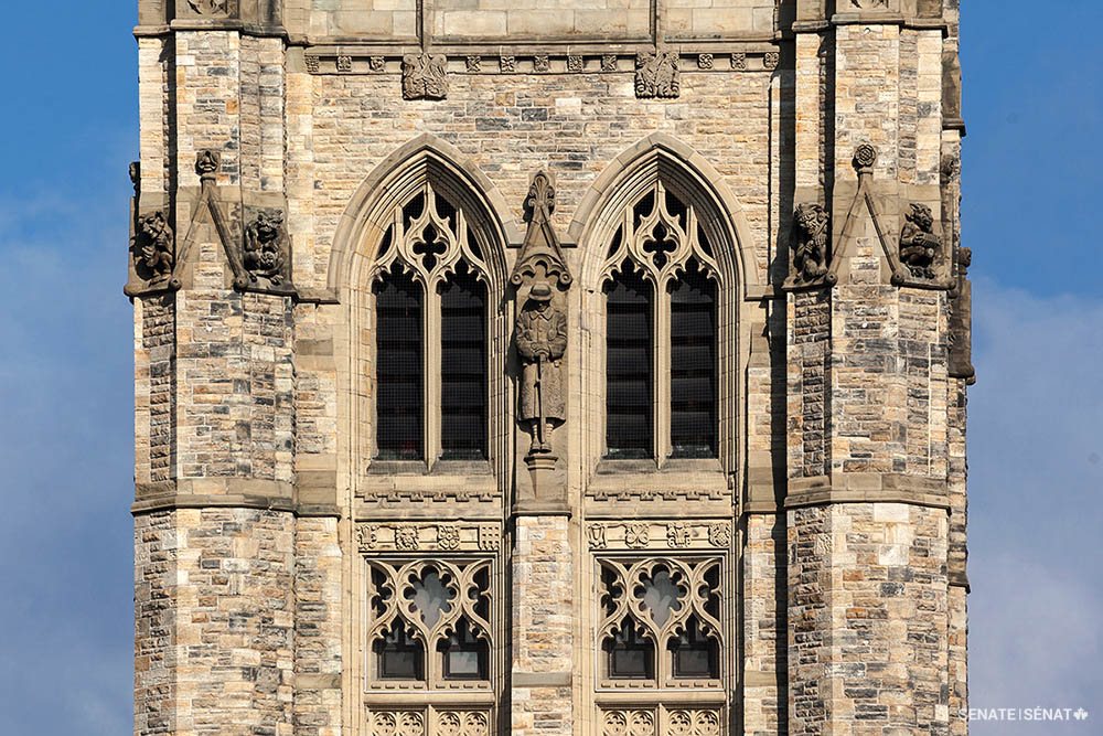The Peace Tower is a memorial to Canada’s wartime sacrifices. Carved figures, such as this soldier grieving his fallen comrades (centre), honour Canadians who died fighting for the country.