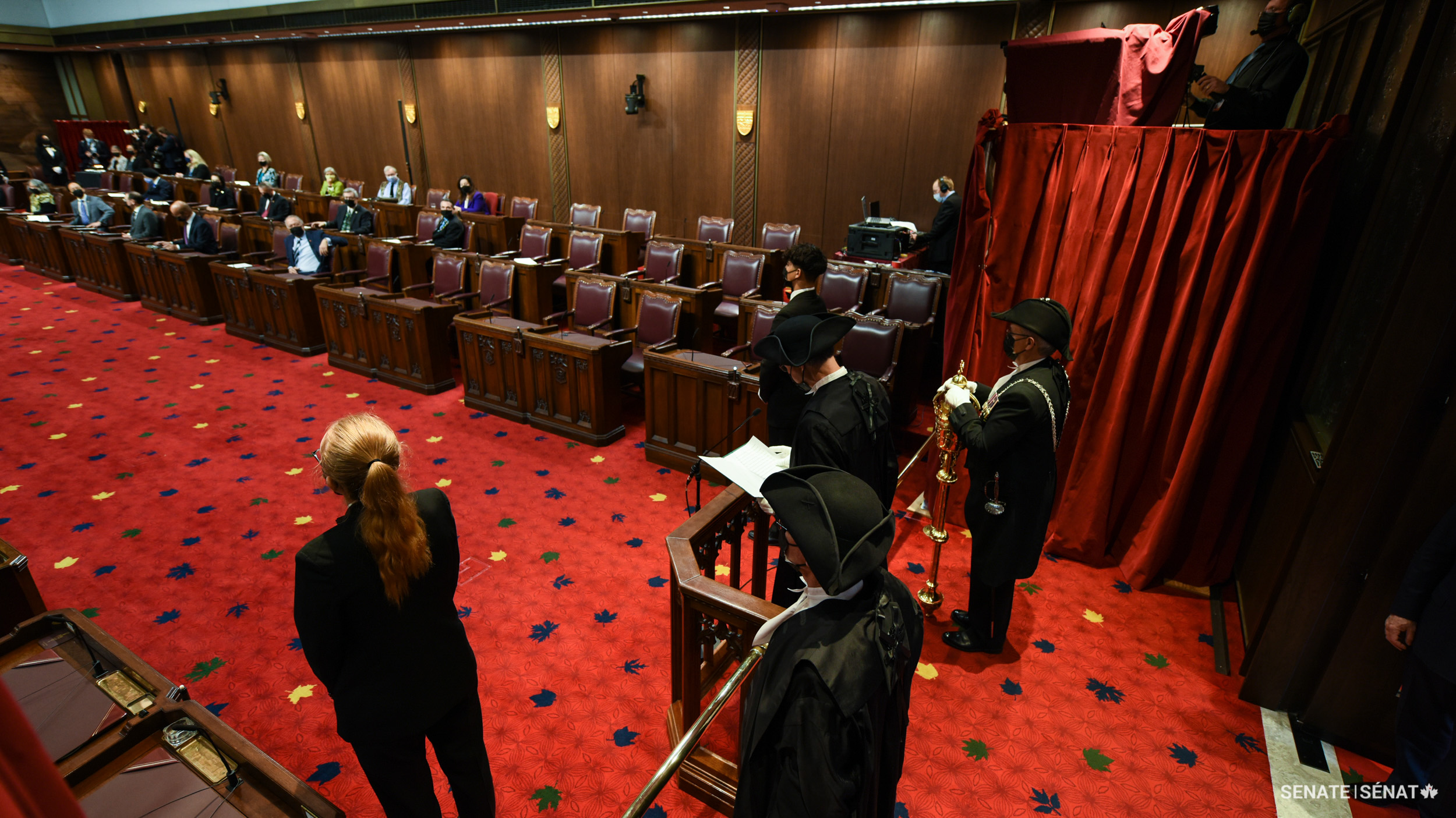 House of Commons Speaker Anthony Rota — flanked on his left by the House Clerk and on his right by the Sergeant-at-Arms — stands on the dais behind the bar in the Red Chamber and “humbly” claims the rights and privileges of the House before the throne speech begins.