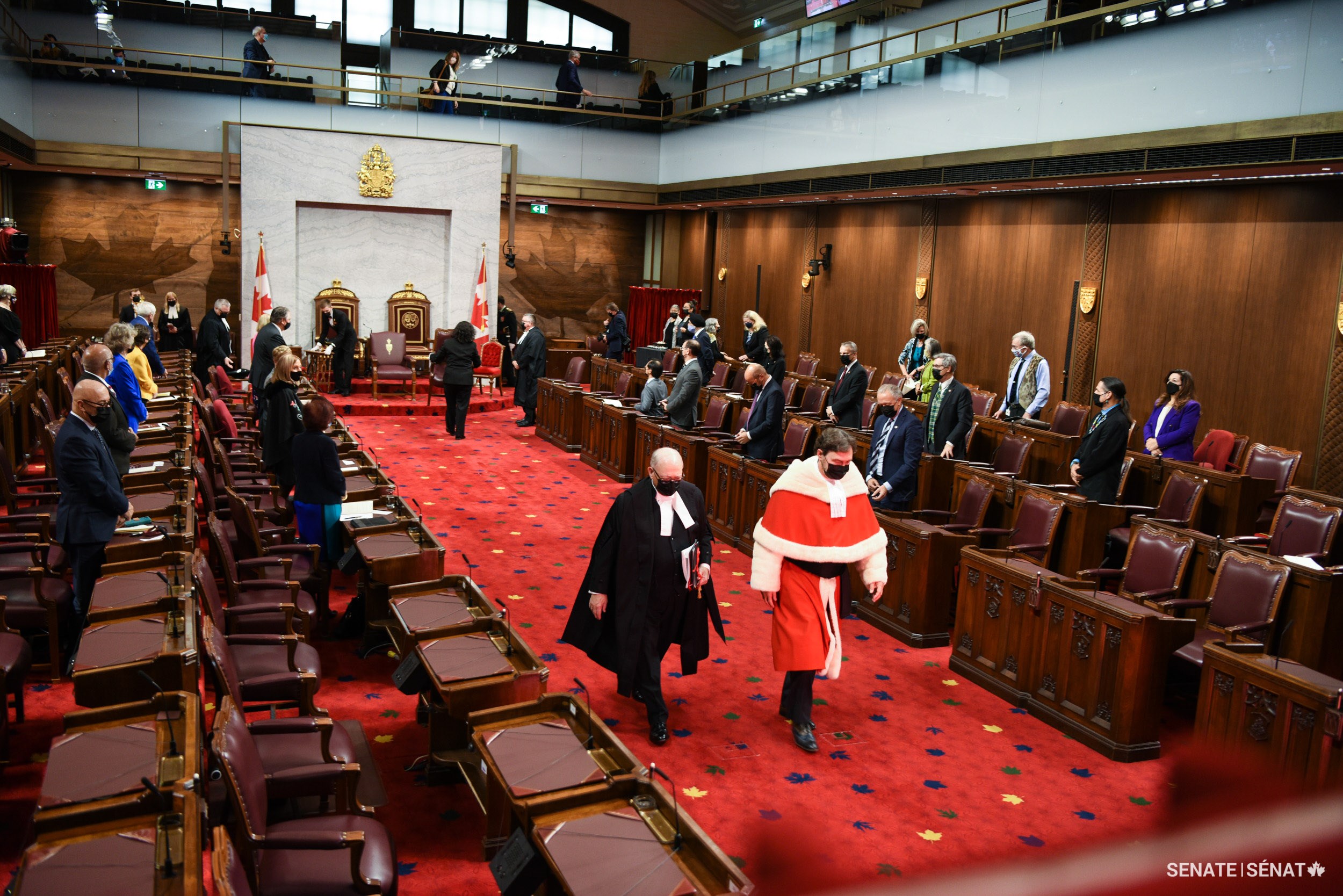 Speaker of the Senate George J. Furey leaves the Chamber with Chief Justice of Canada Richard Wagner.