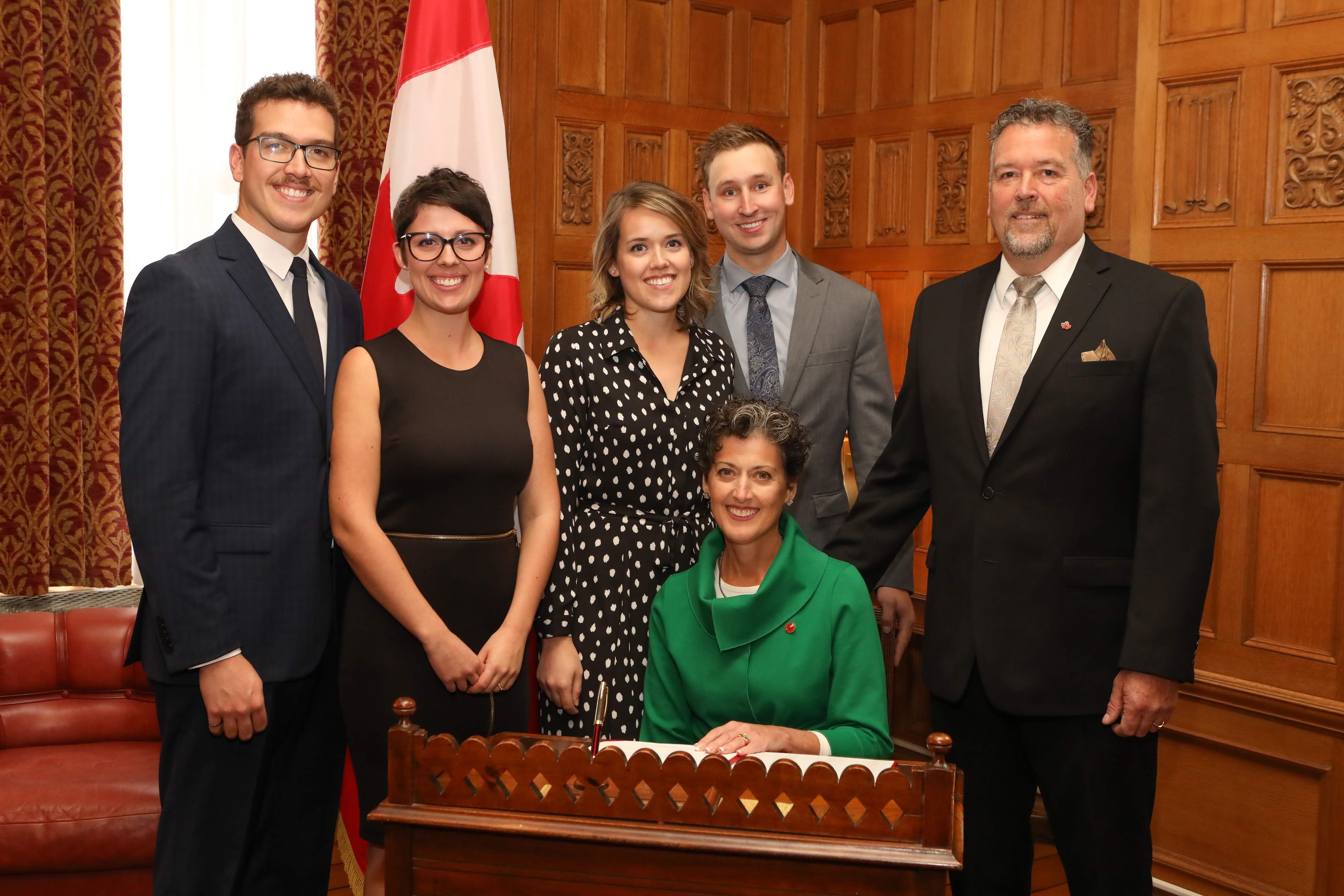 Senator Josée Forest-Niesing, seated, was joined by her family when she was sworn in to the Senate in October 2018. From left, son Philippe Niesing and daughter-in-law Catherine Sampson, daughter Véronique Niesing and son-in-law Andrew Moss, and husband Robert Niesing.