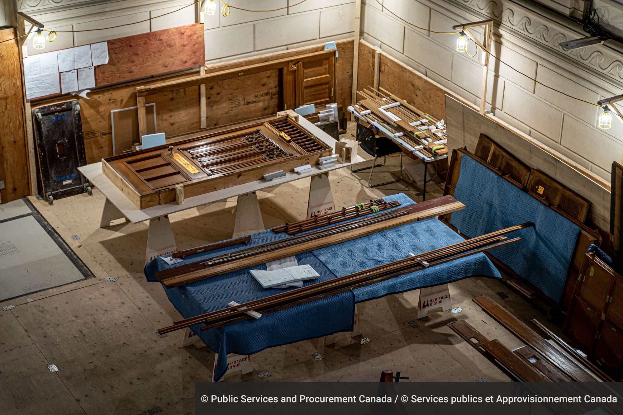 Once catalogued and dismantled, the removed woodwork is brought to a staging area so it can be protected by a packing team before its journey to a climate-controlled storage facility.