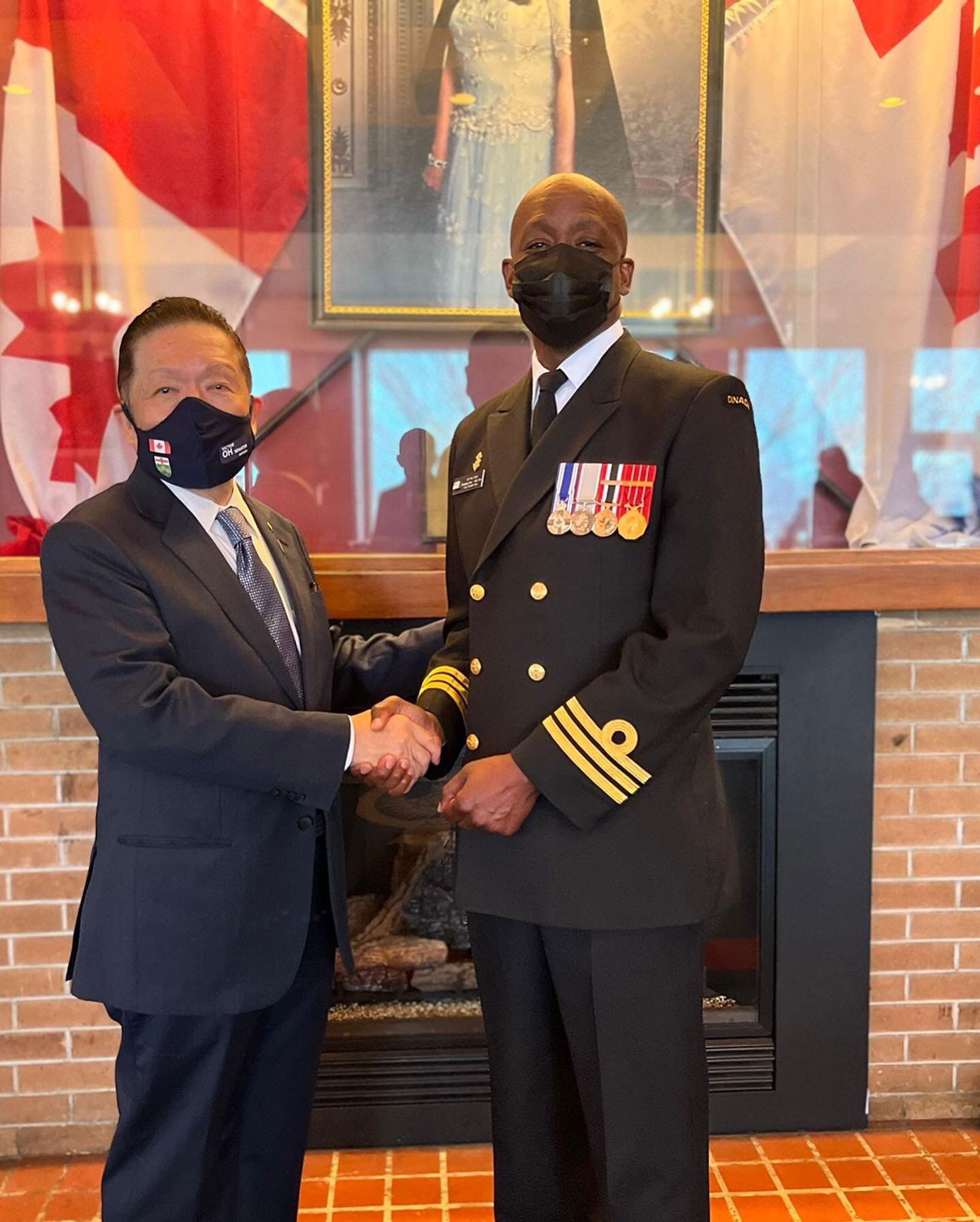 Senator Victor Oh meets with Cdr Paul Smith, Commander of Her Majesty’s Canadian Ship (HMCS) York, during an event commemorating the Battle of the Atlantic at the Royal Canadian Navy Reserve Division in Toronto, Ontario.