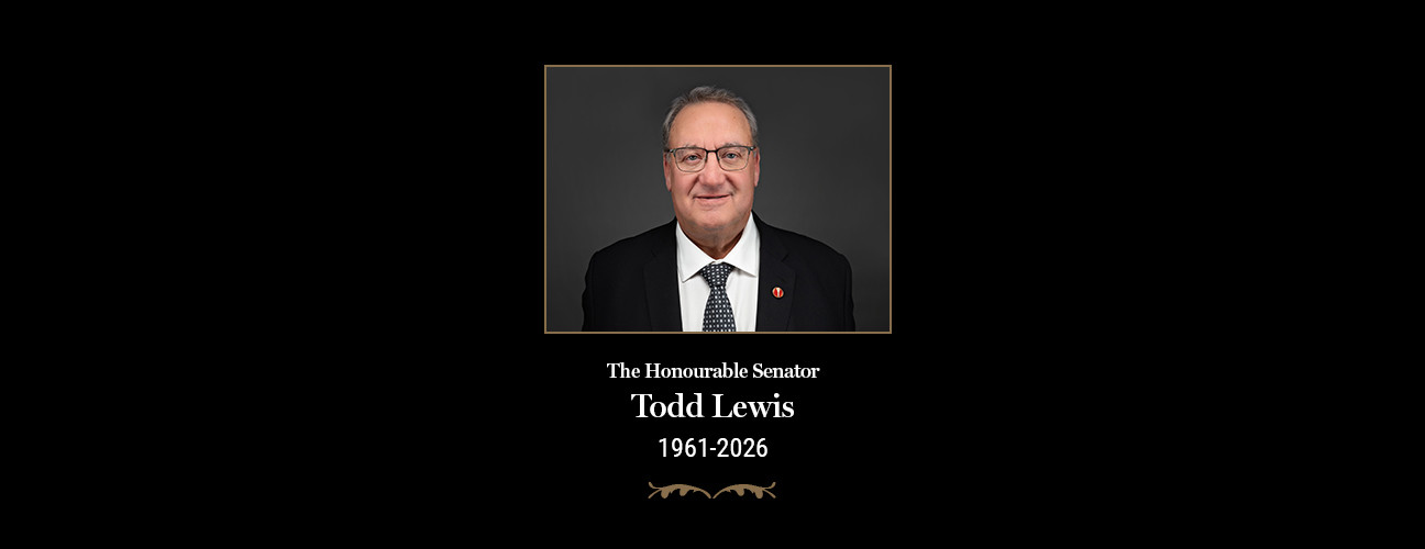 Portrait of The Honourable Senator Todd Lewis above the memorial inscription "The Honourable Senator Todd Lewis, 1961–2026" on a black background.