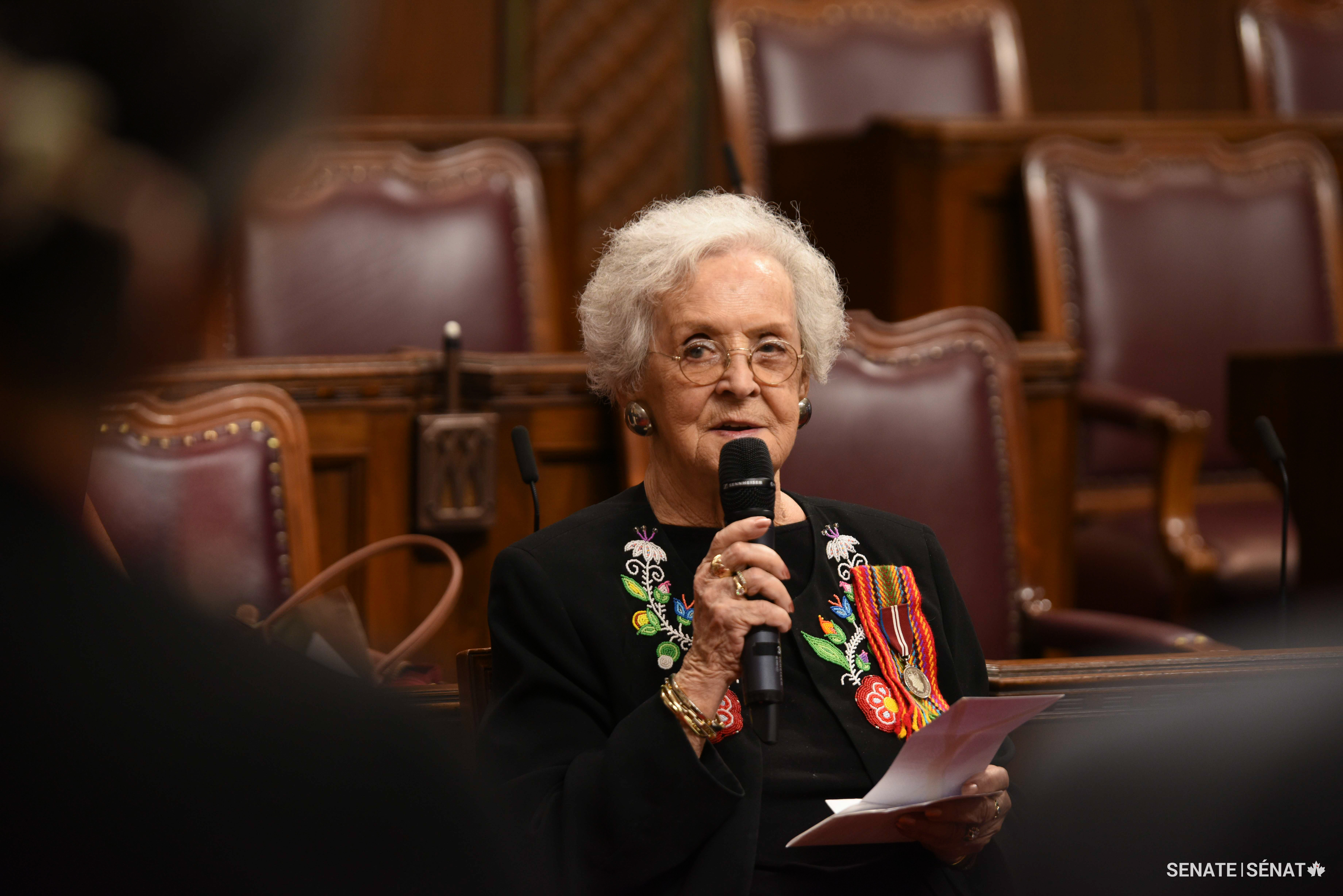 Métis Elder Reta Gordon recites a traditional prayer during the opening ceremony in the Red Chamber.