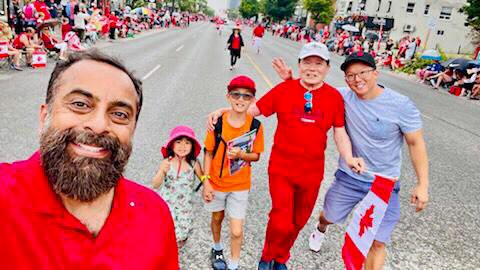 Friday, July 1, 2022 – Senator Victor Oh participates in the annual Paint The Town Red, Port Credit Canada Day celebrations in Mississauga, Ontario. Senator Oh was joined by his family and Imran Hansan, chair of the Peel Region Crime Stoppers (left).