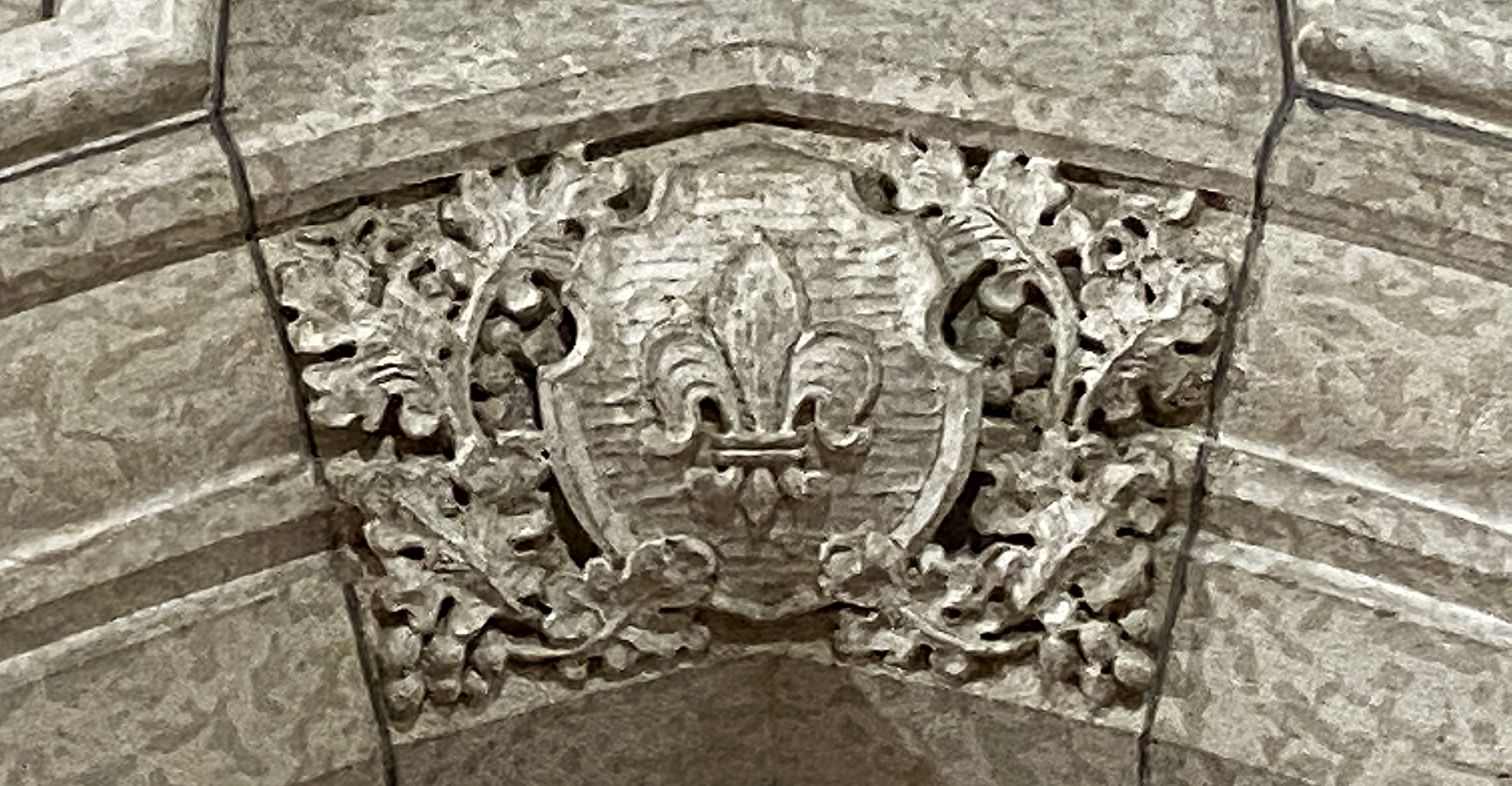 A fleur-de-lis is carved into the arch above a doorway in Centre Block.