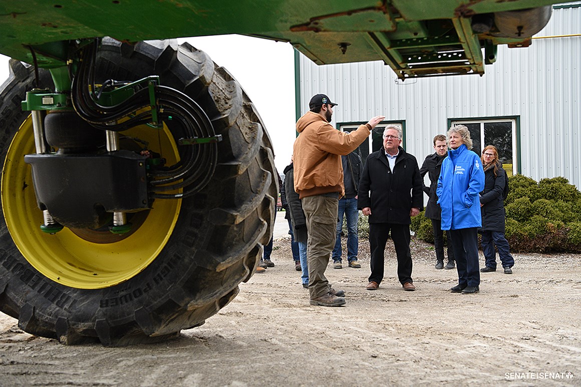 Operator Ben Bellman gives senators a tour of Woodrill. Senators learned about the company’s soil-mapping program, called GroundWork, that aims to help producers boost their crop yields.