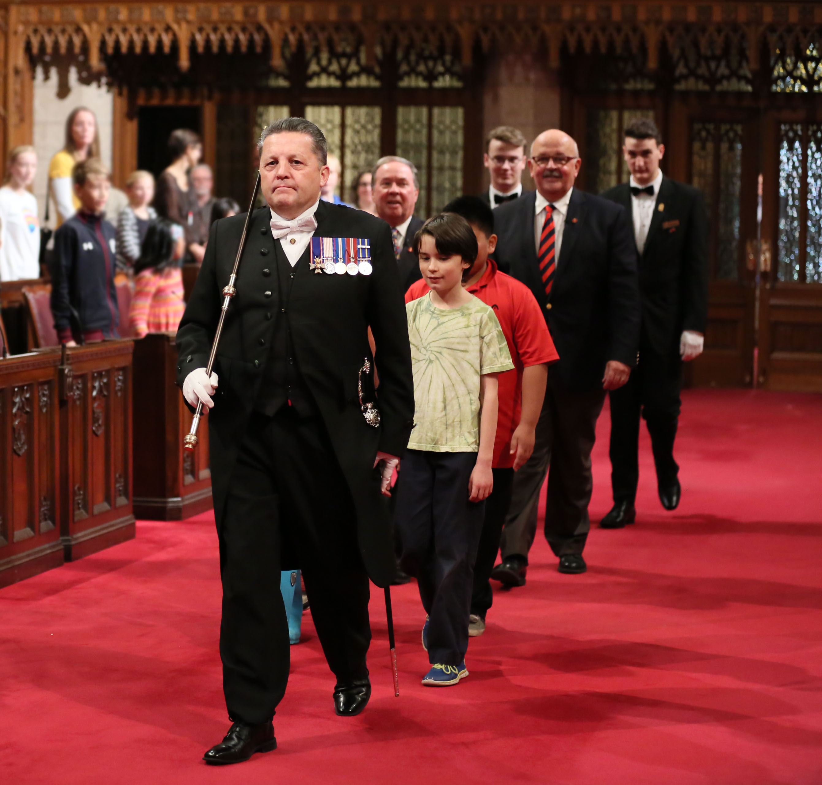The Usher of the Black Rod leading the parade into the chamber