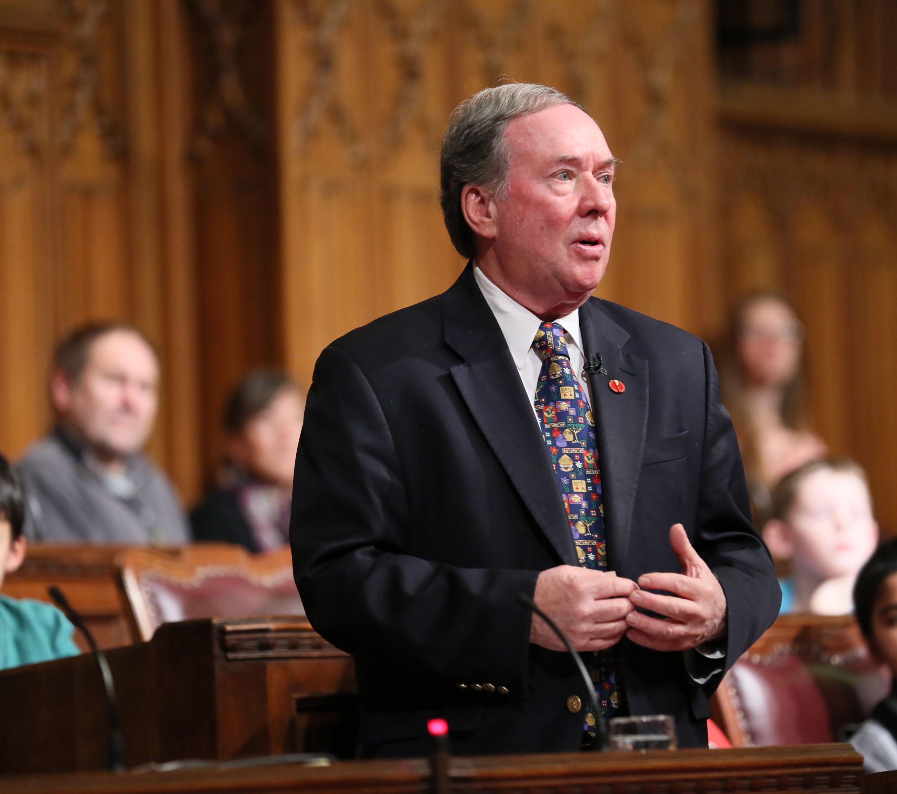Photo of Senator Munson speaking in the chamber