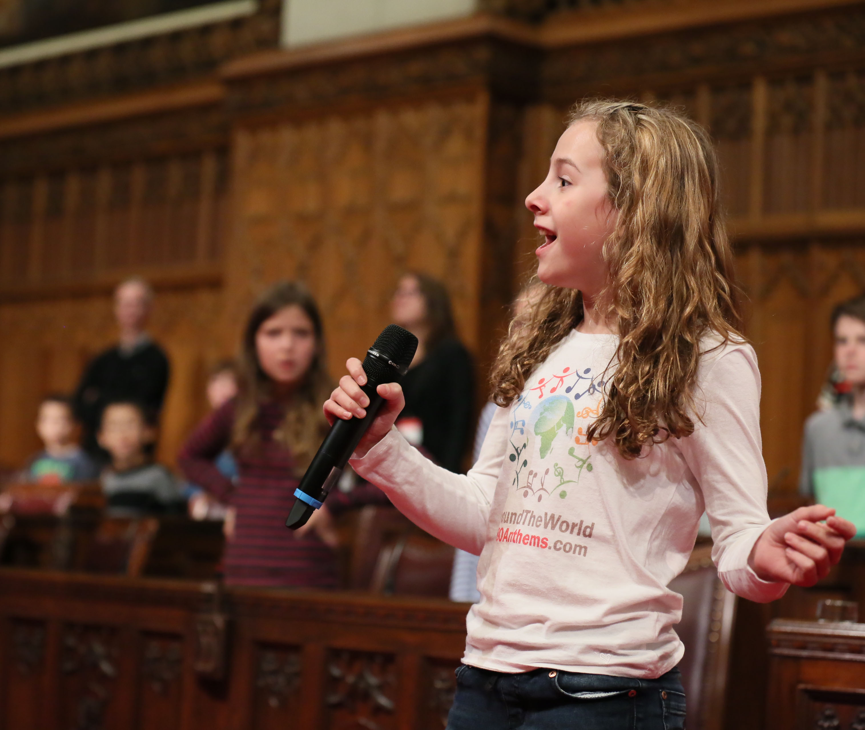 Photo of Capri Everitt, an 11 year old from British Columbia singing in the chamber
