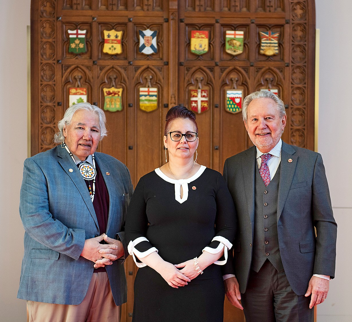 Senator Anderson is greeted in the Red Chamber by Senator Peter Harder (right) and then-senator Hon. Murray Sinclair before attending her first Senate sitting on February 19, 2019.