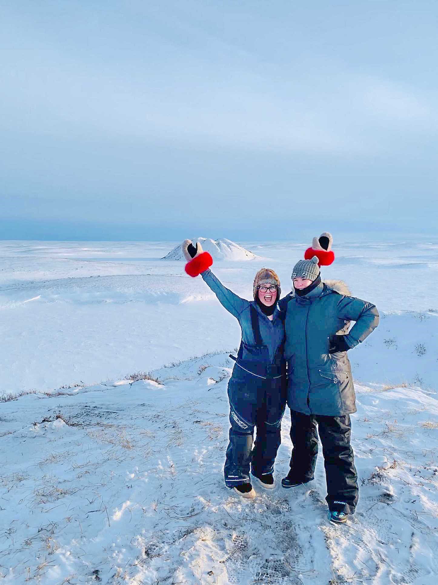 Senator Anderson (left) and Mélanie Donoghue, her former executive assistant, on the Pingo Canadian Landmark in Tuktoyaktuk, Northwest Territories, on March 11, 2019. (Photo credit: Office of Senator Dawn Anderson)