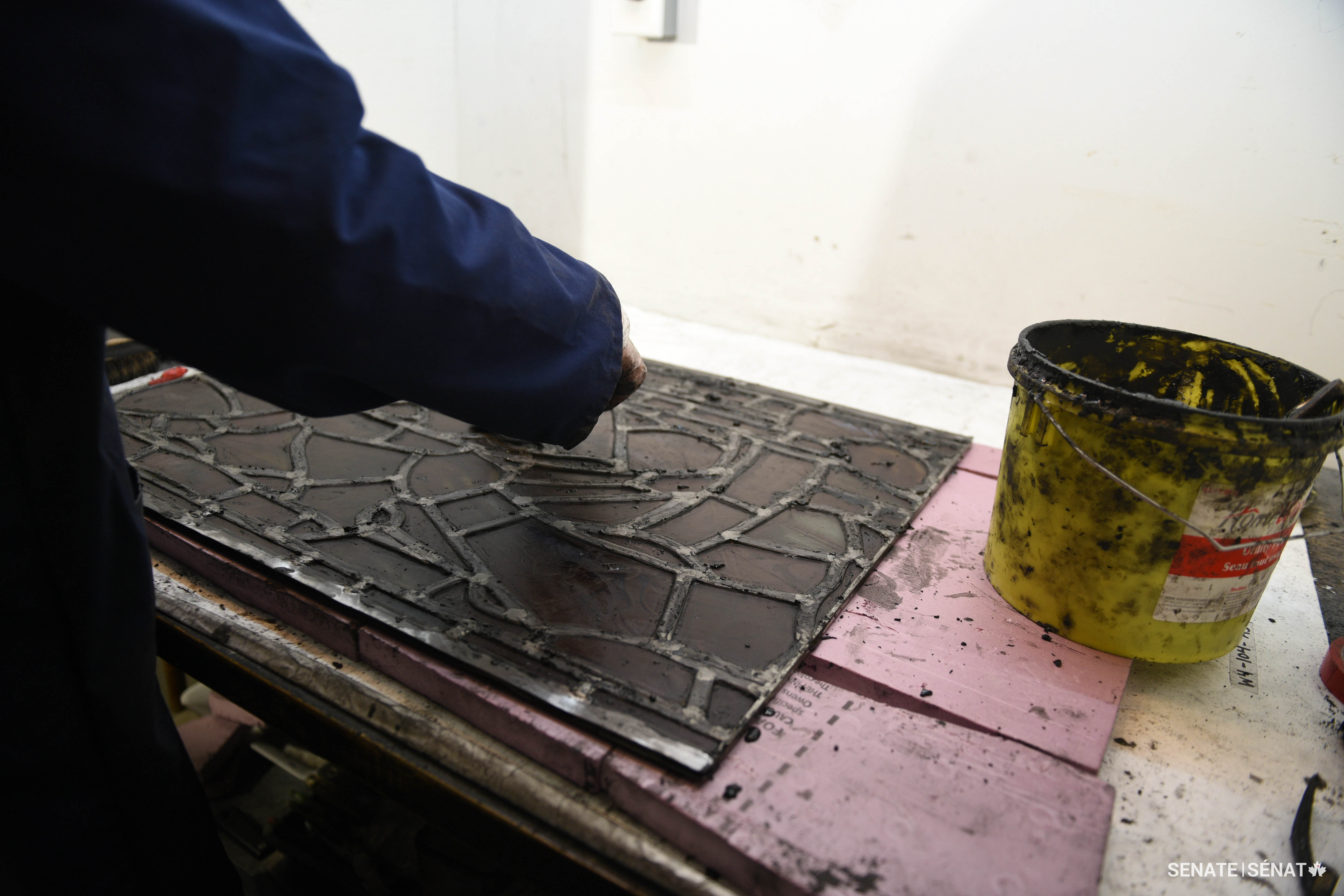 A special glazing compound makes this window airtight and waterproof, and protects the lead from oxidizing.