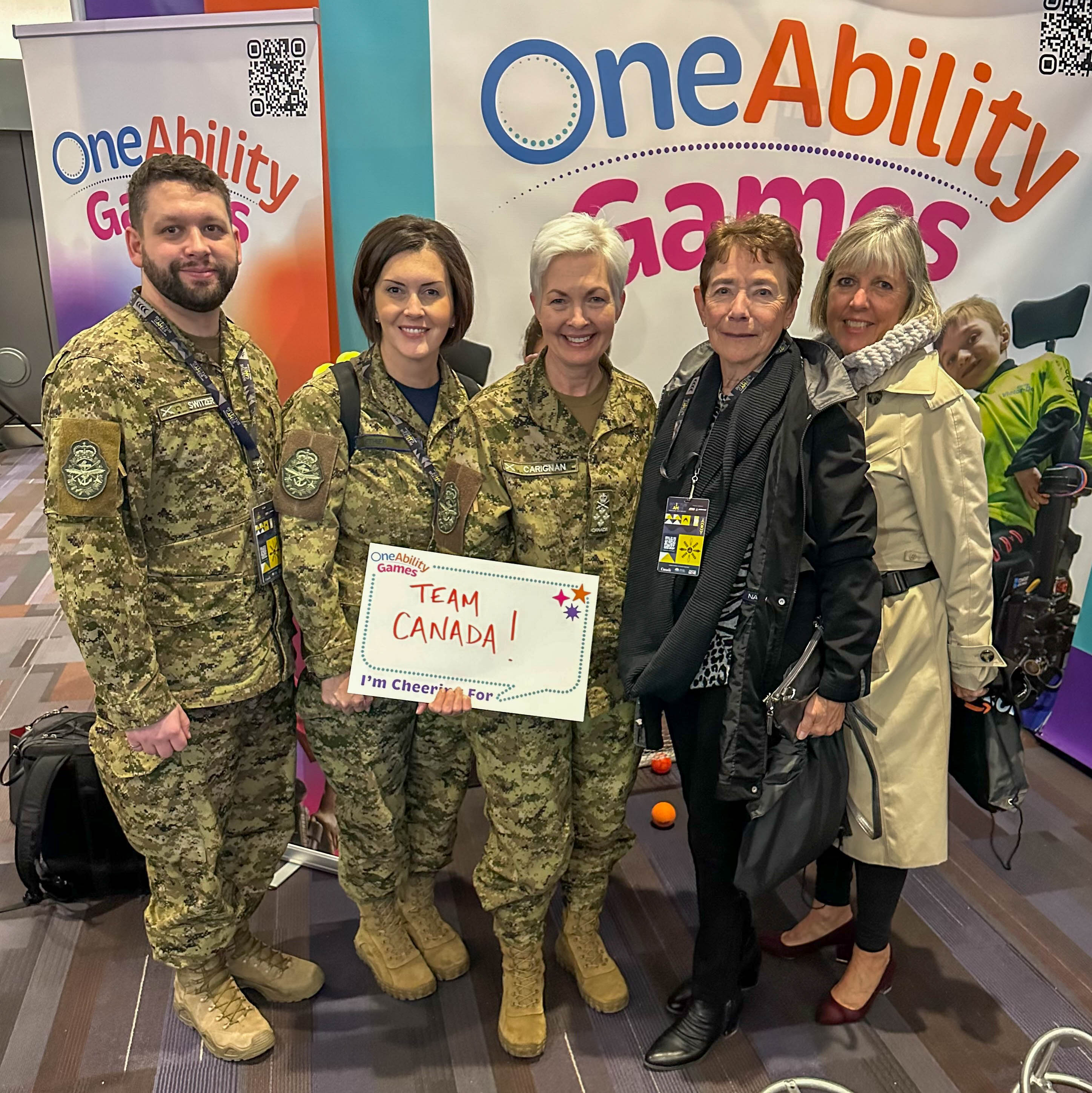 Sunday, February 9, 2025 – Senators Marty Deacon and Bev Busson, right, with General Jennie Carignan, centre, and members of the Canadian Armed Forces; Invictus Games; Invictus Village; Vancouver, British Columbia.