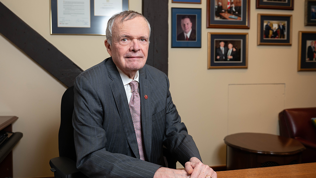 Senator Stephen Greene poses in his Senate office.