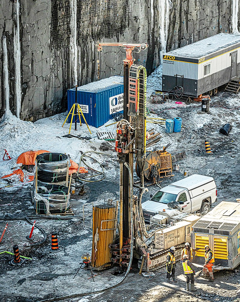 A mobile drilling rig lowers a drill into the ground. Sections of drill shaft are continuously added as the borehole deepens. (Photo credit: Public Services and Procurement Canada)