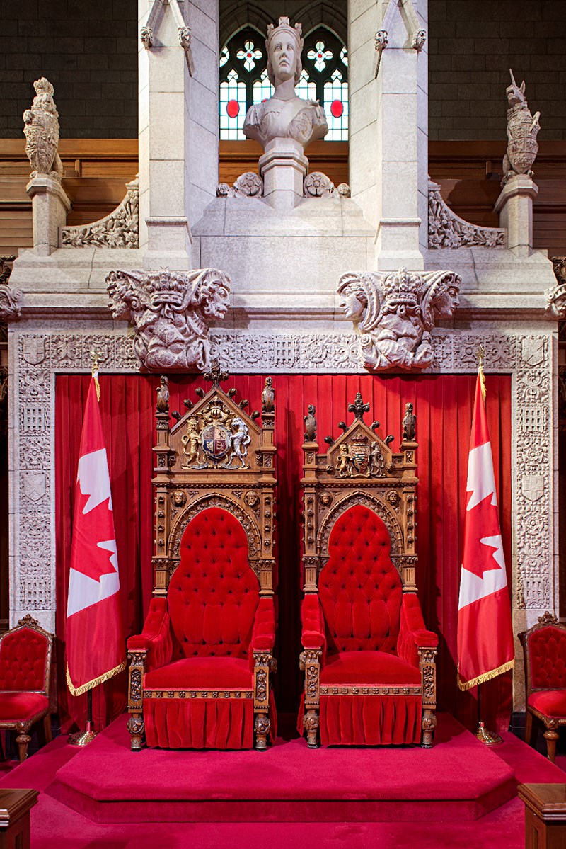 The Speaker’s dais in Centre Block’s Senate Chamber is a showcase of royal symbols, including Tudor roses, portcullises, crowns and stylized effigies of monarchs.