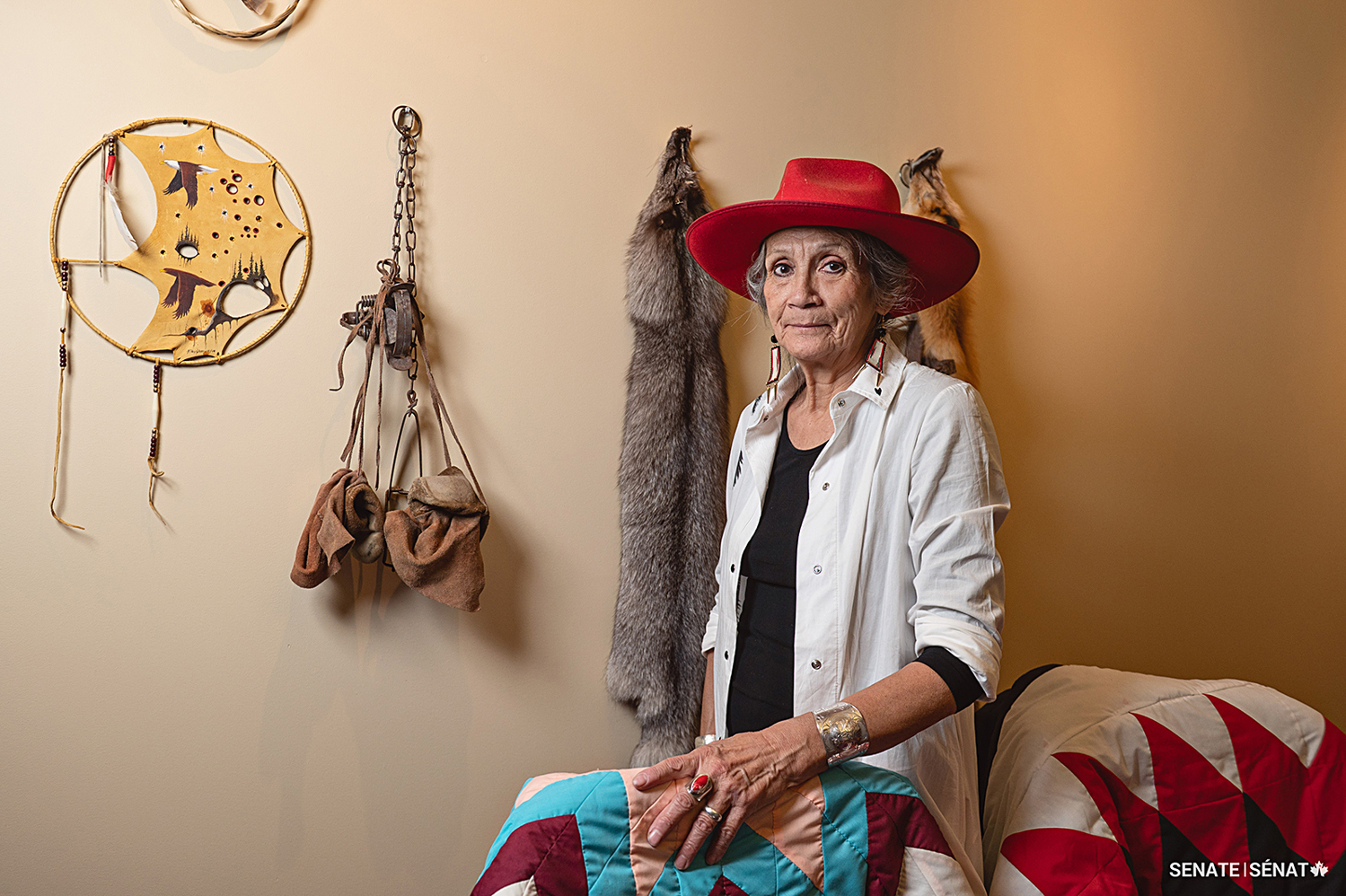 Senator McCallum’s office is decorated with old trapping gear and furs from home, as well as artwork from Indigenous artists based in Manitoba.